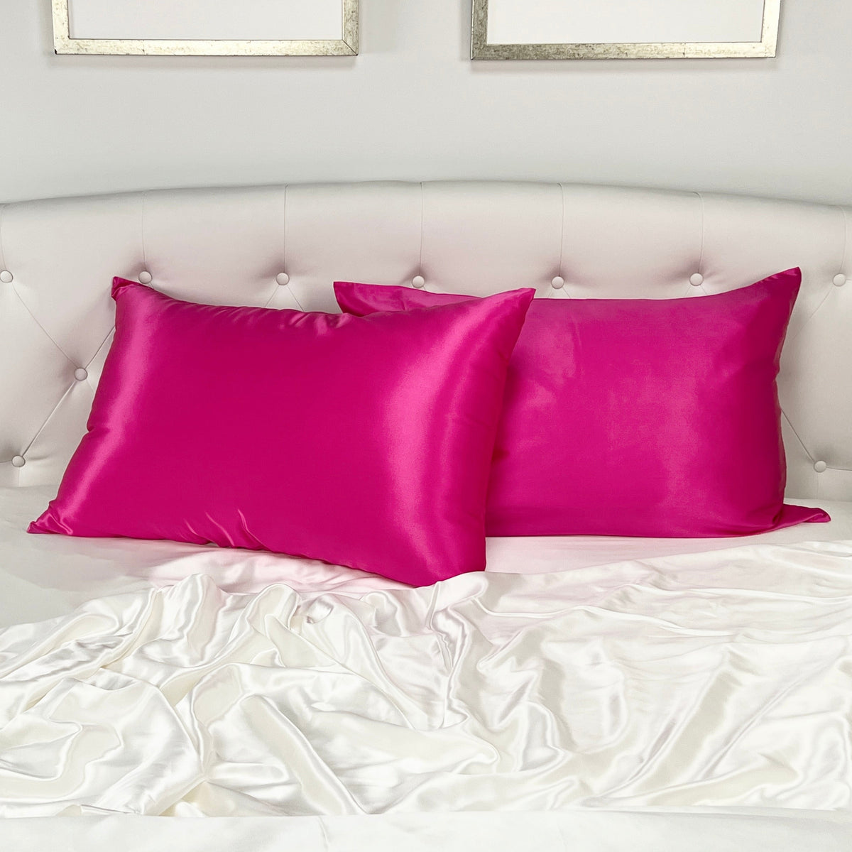 Magenta silk pillowcase with a smooth, glossy finish, placed on the headboard bed