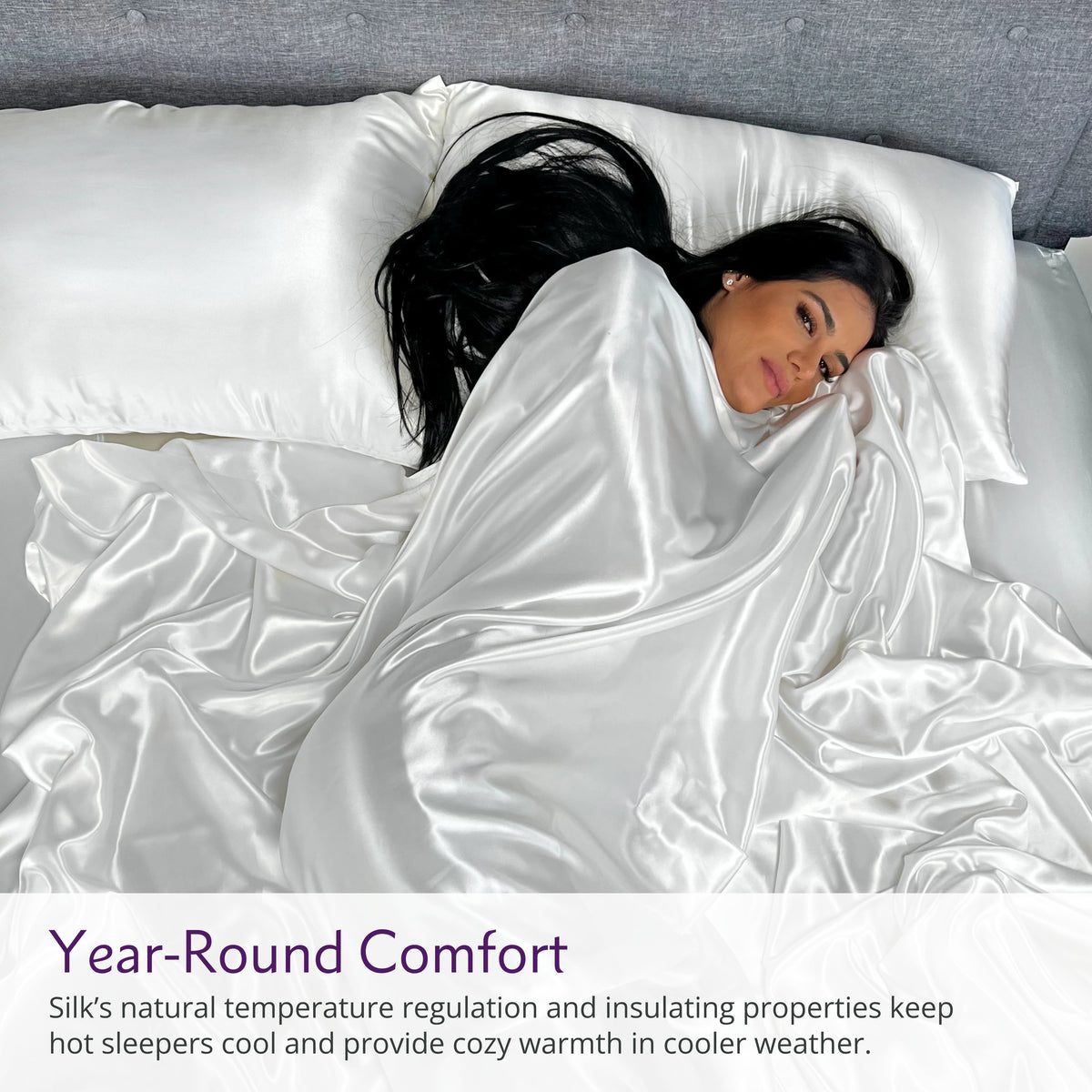 Woman sleeping on a white silk bed sheet set with matching pillow, showcasing ultimate comfort