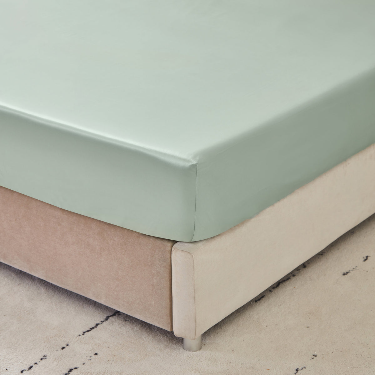 Close-up of 6A grade Mulberry Park Silk fitted sheet showcasing smooth and snug fit on mattress
