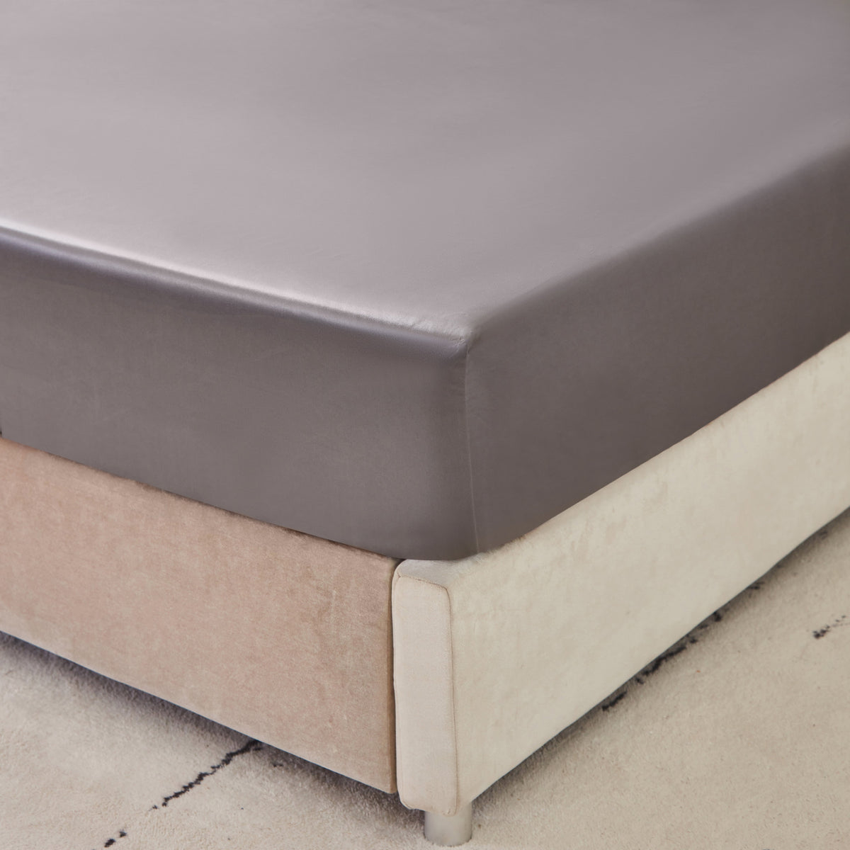 Close-up of 6A grade Mulberry Park Silk fitted sheet showcasing smooth and snug fit on mattress