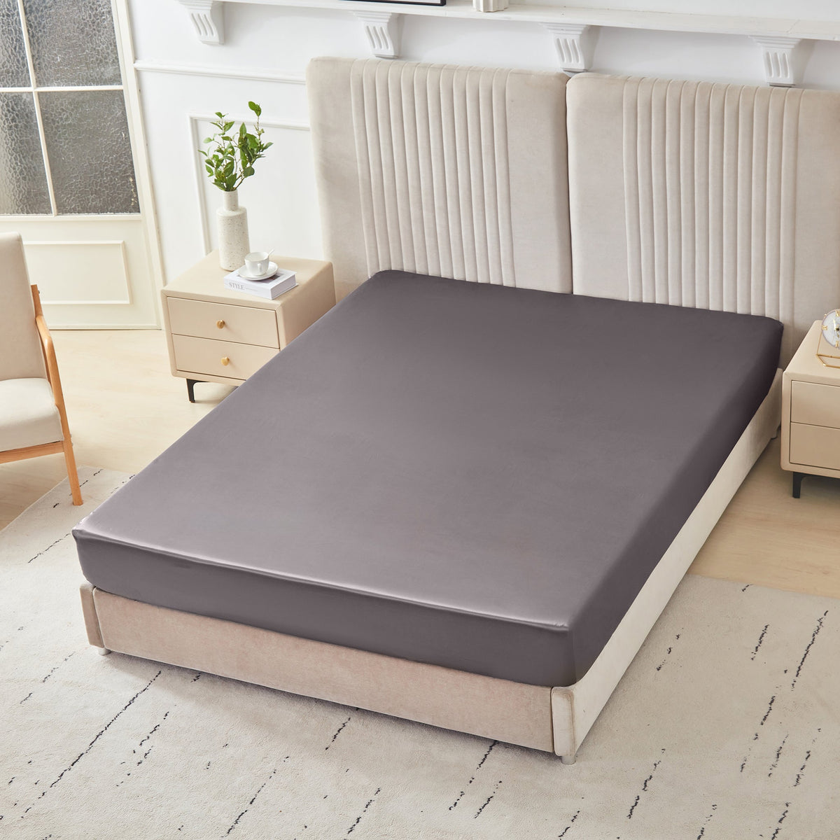 Mulberry Park Silks 22 Momme Silk Fitted Sheets in Gunmetal on bed with upholstered headboard in a cozy bedroom setting