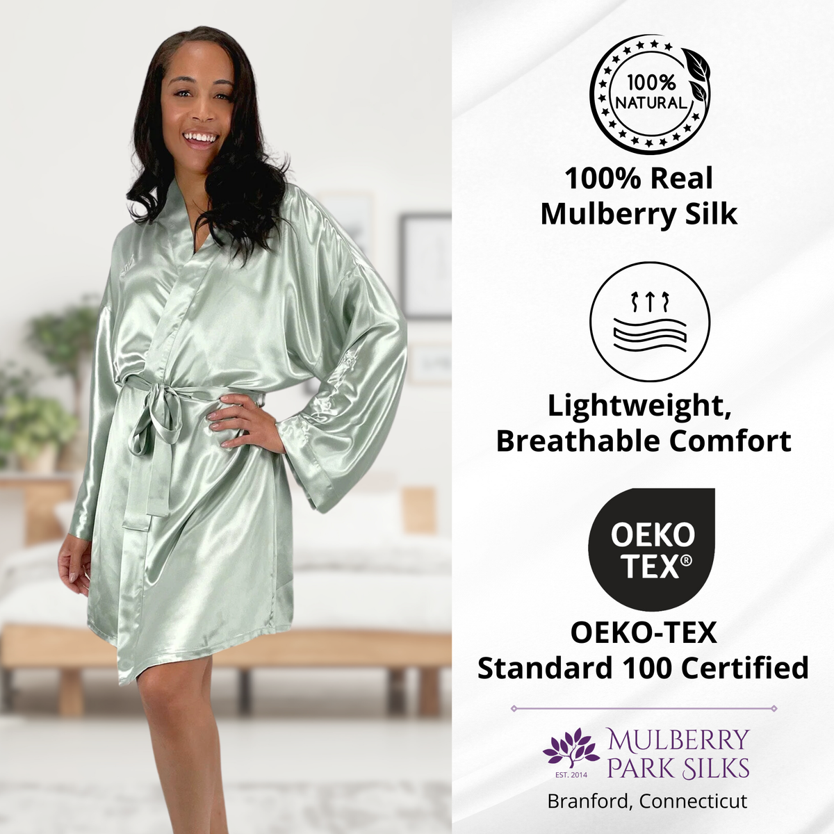 Woman in a sage silk kimono robe smiles in a bedroom, highlighting Mulberry silk luxury