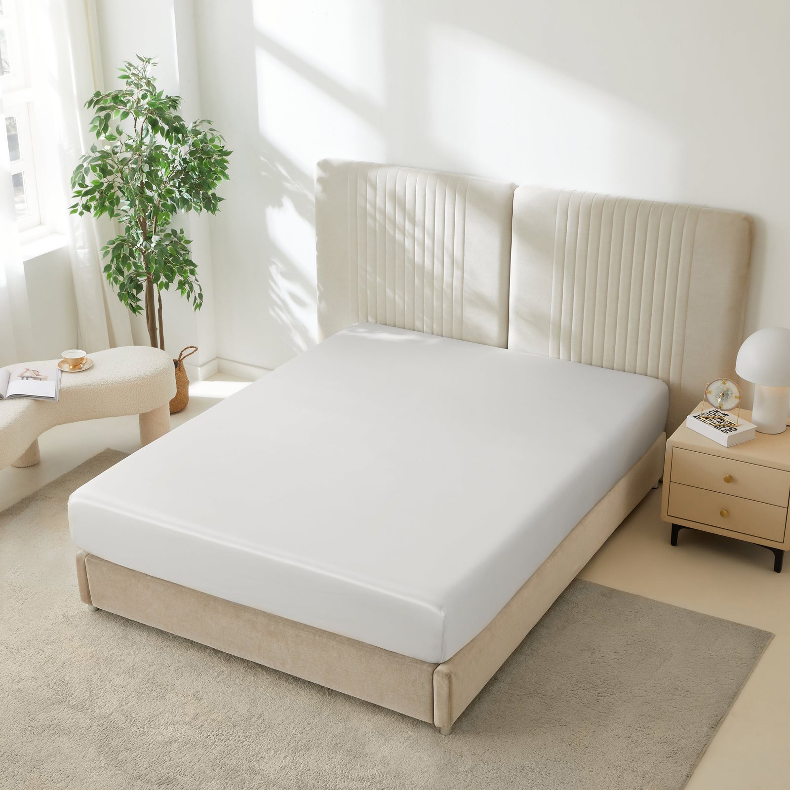 Mulberry Park Silks 22 Momme Silk Fitted Sheets in White on bed with upholstered headboard in a cozy bedroom setting