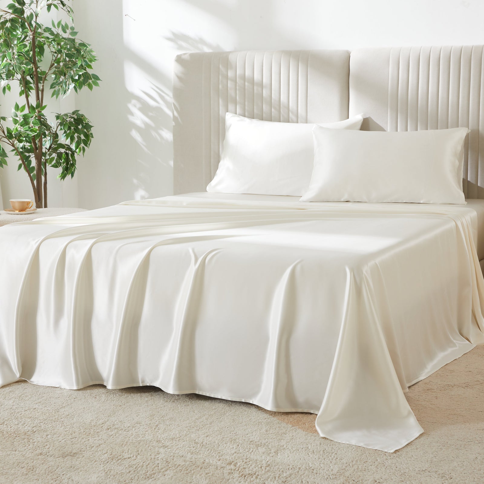 Elegant 22 Momme Silk Sheets Set in Ivory color displayed on a beautiful bed with 2 silk pillows