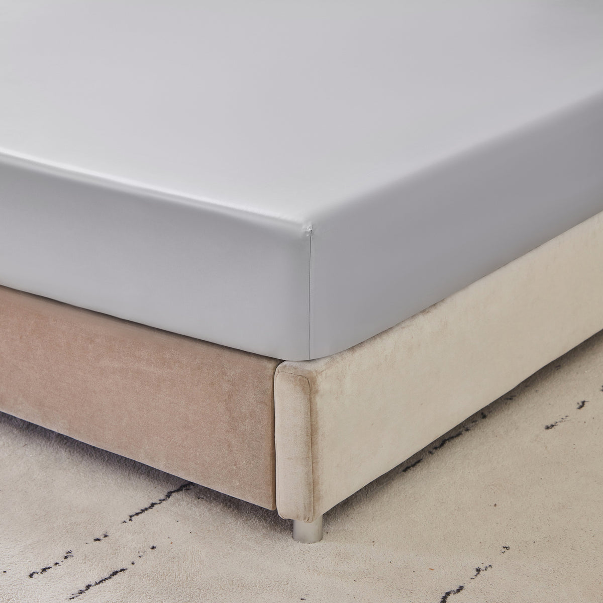 Close-up of 6A grade Mulberry Park Silk fitted sheet showcasing smooth and snug fit on mattress