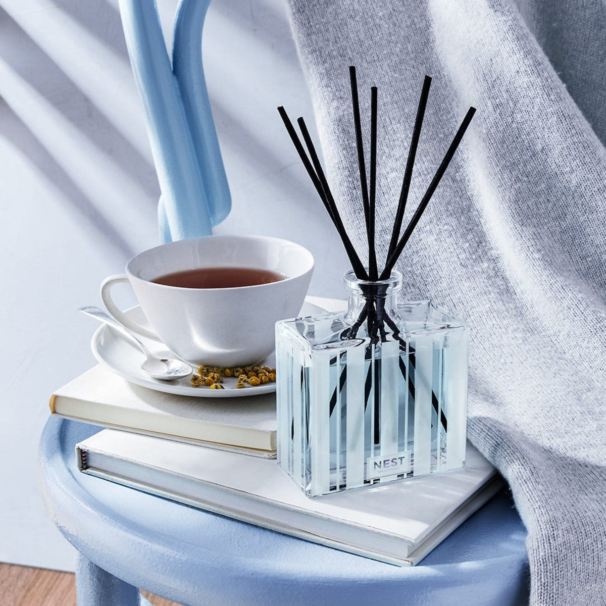 Nest New York’s Driftwood and Chamomile Reed Diffuser Lifestyle On Nightstand