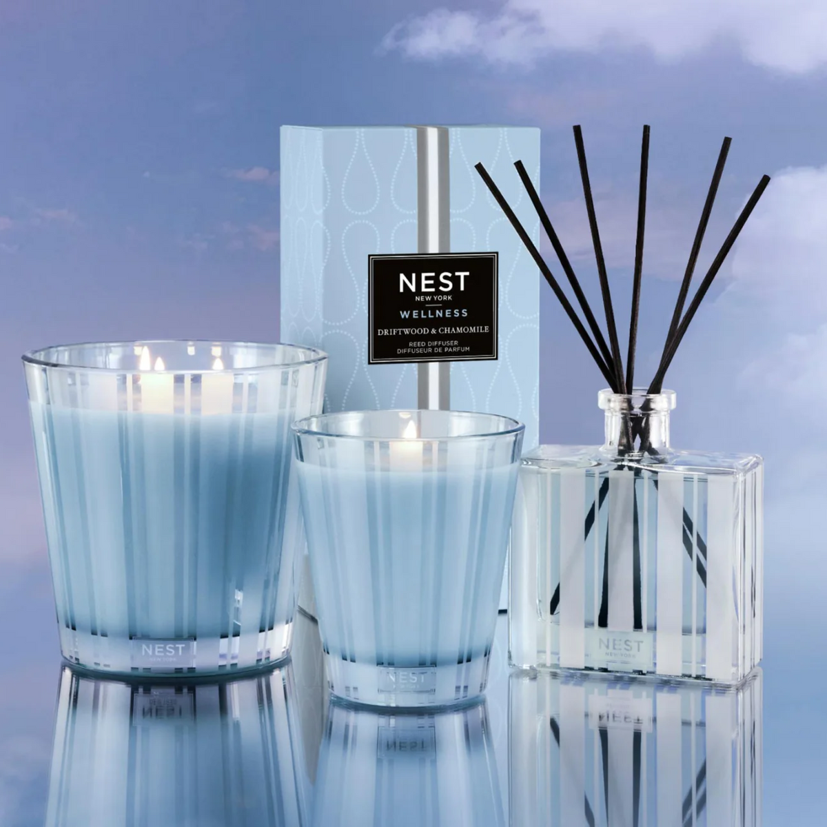 Lifestyle of Nest New York Driftwood and Chamomile Reed Diffuser with Classic and 3-Wick Candles