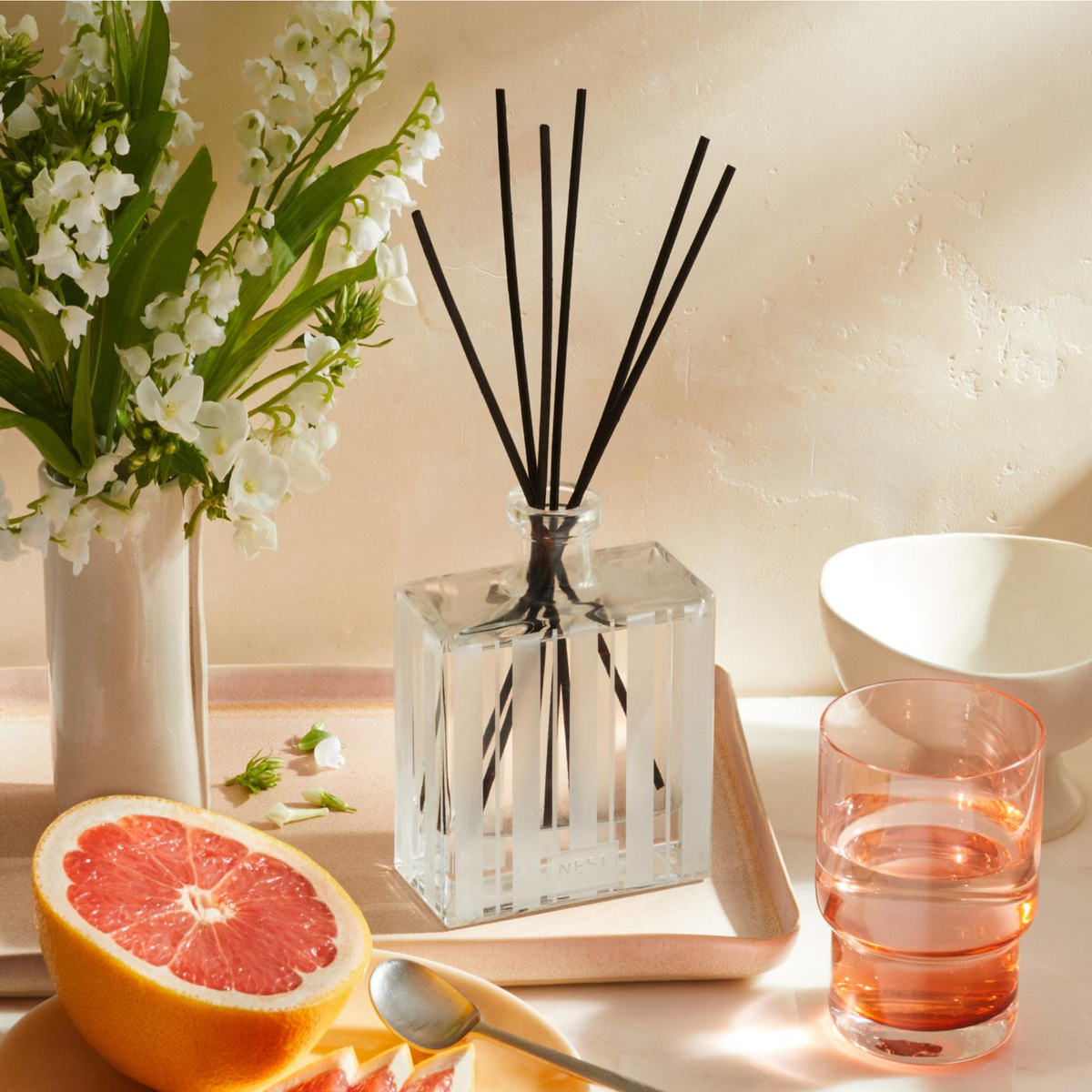 Nest New York’s Grapefruit Reed Diffuser Lifestyle in Tray on Counter