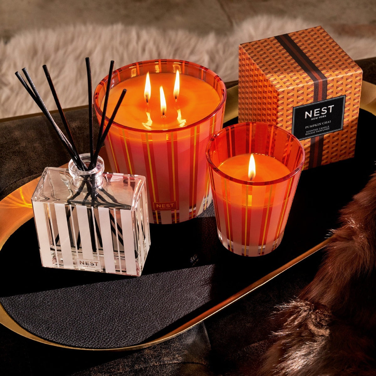 Topview Lifestyle Photo of Nest New York’s Pumpkin Chai Classic Candle with 3 Wick and Diffuser