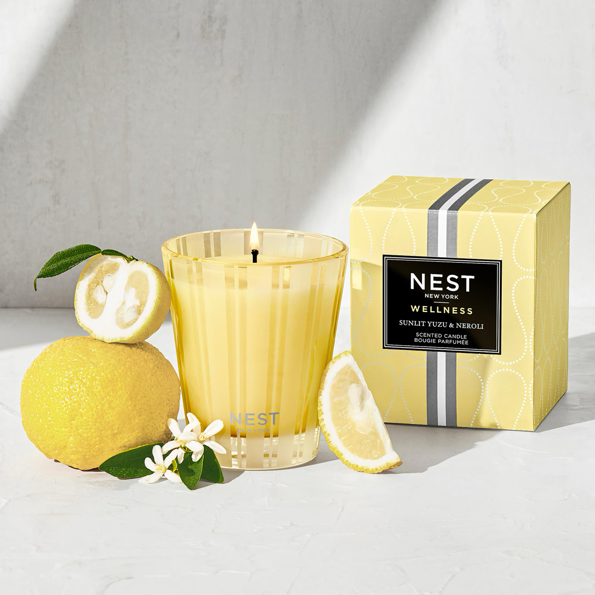 Lifestyle with Box of Nest New York Sunlit Yuzu and Neroli Candle