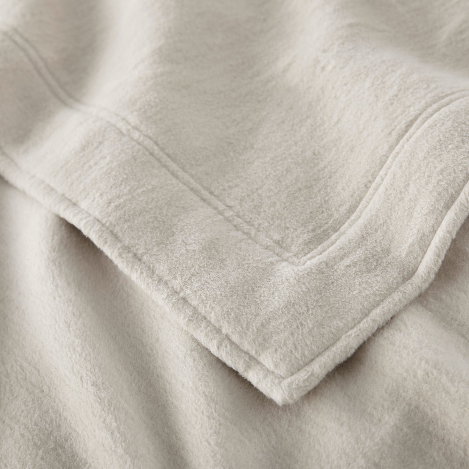 Folded Peacock Alley All Seasons Framed Blanket in Flint color