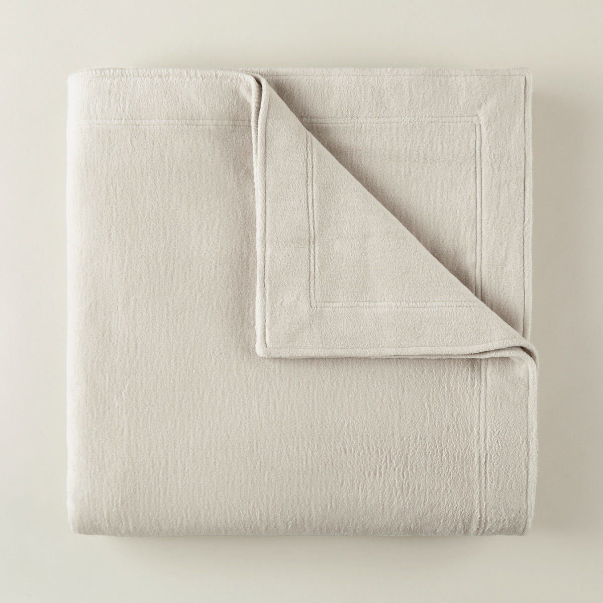 Folded Peacock Alley All Seasons Framed Blanket in Flint color