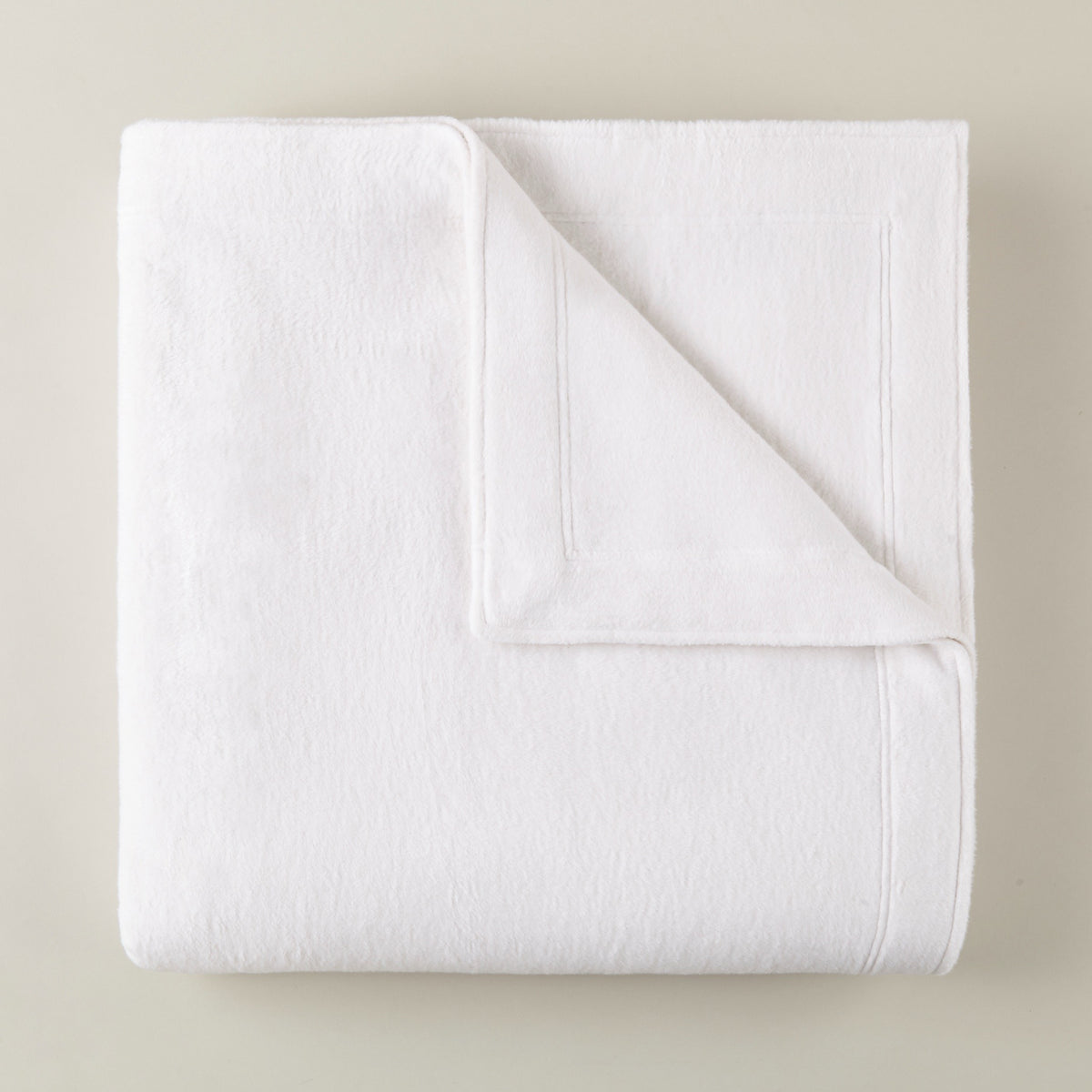 Folded Peacock Alley All Seasons Framed Blanket in White color