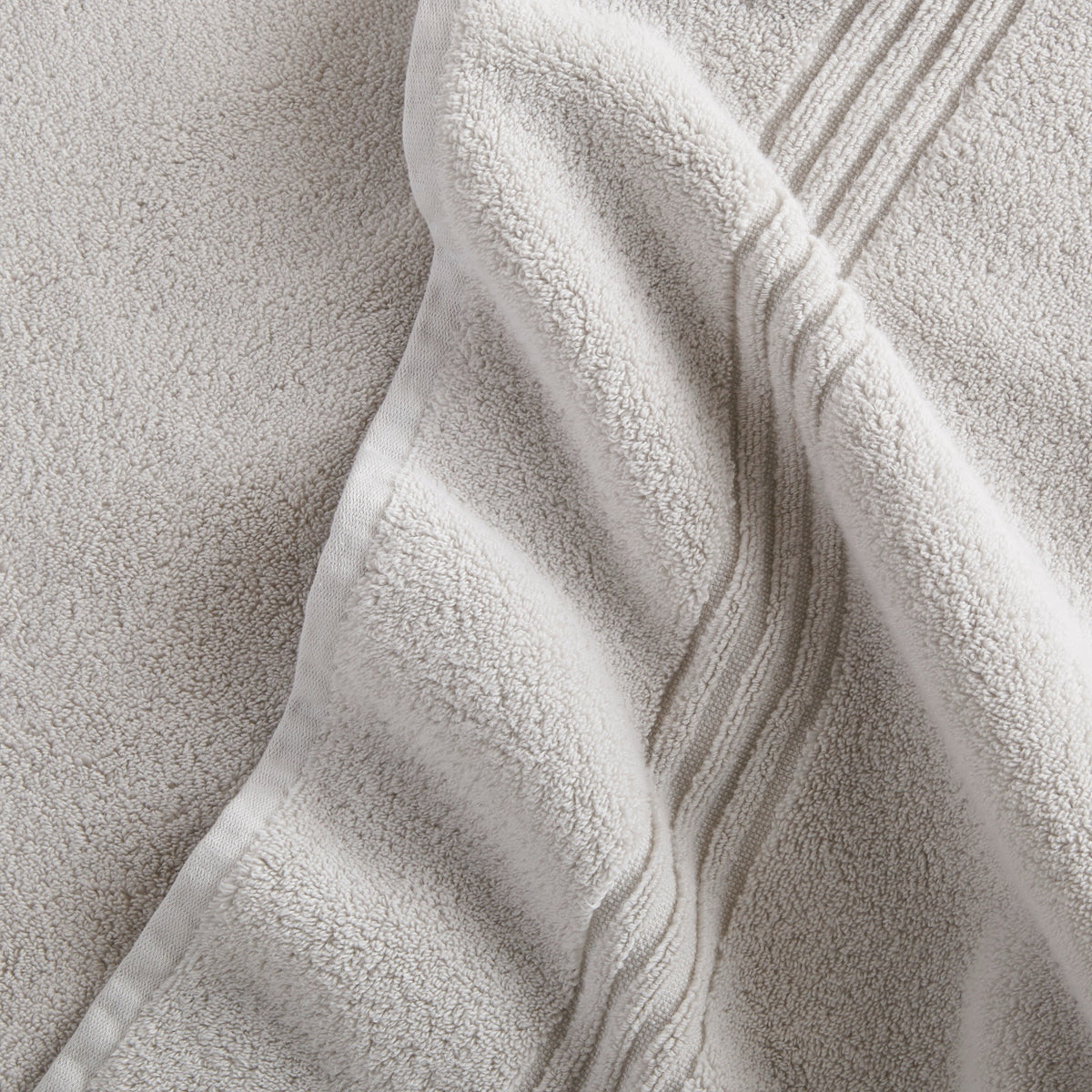 Close-up of Peacock Alley Chelsea Bath Towel in Pewter color