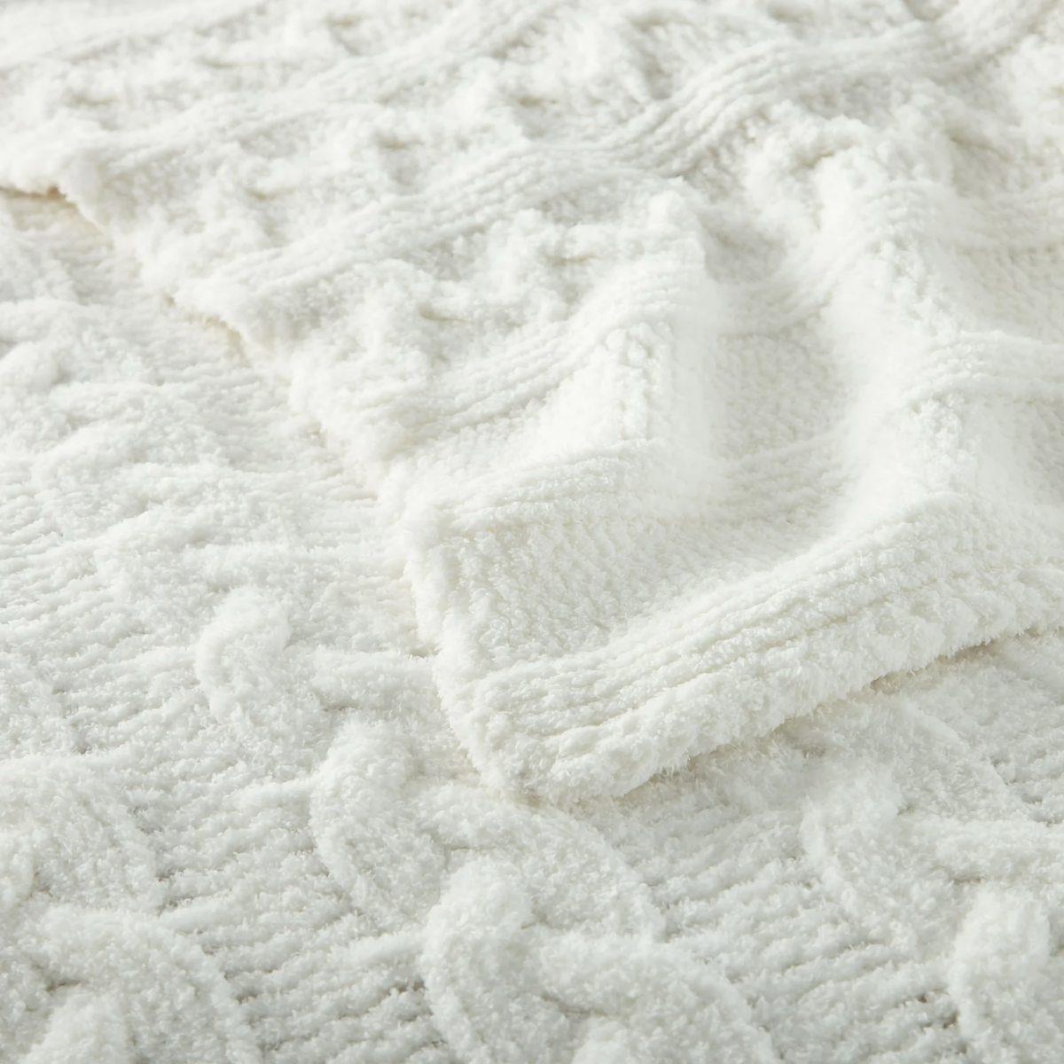Closeup of Peacock Alley Cozy Cable Knit Throw in White