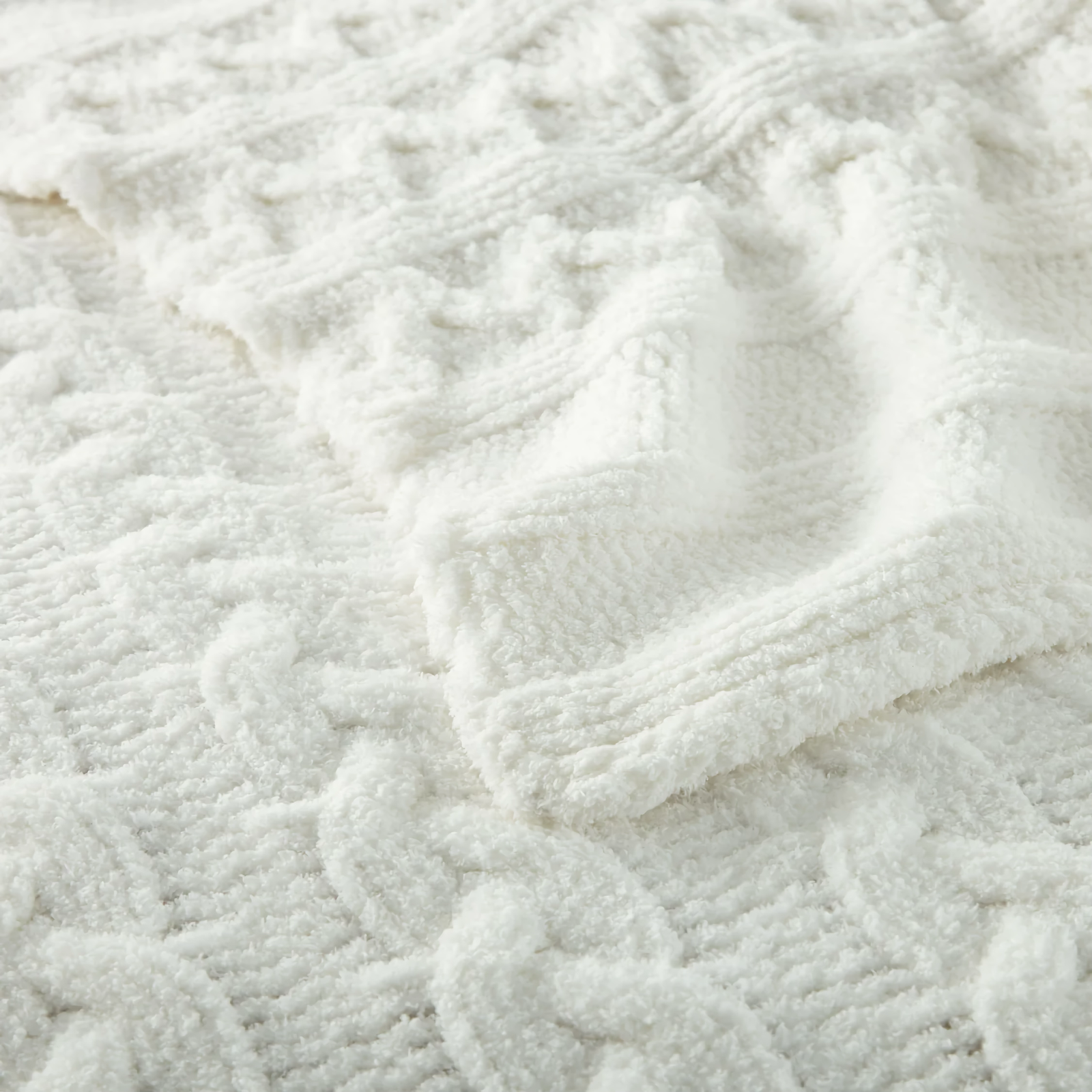 Folded Peacock Alley Cozy Cable Knit Throw in White