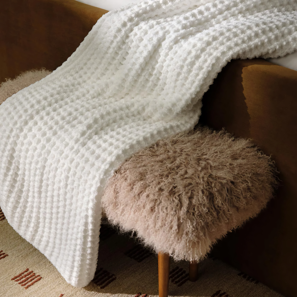 Lifestyle Photo of Peacock Alley Cozy Waffle Knit Throw in White