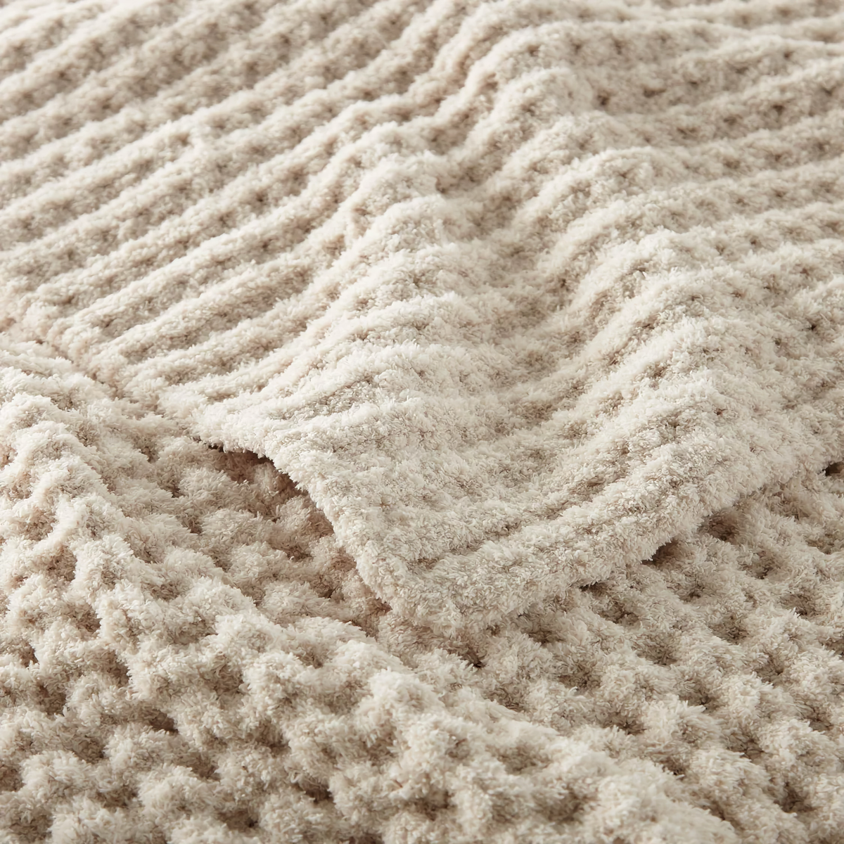 Closeup of Peacock Alley Cozy Waffle Knit Throw in Linen