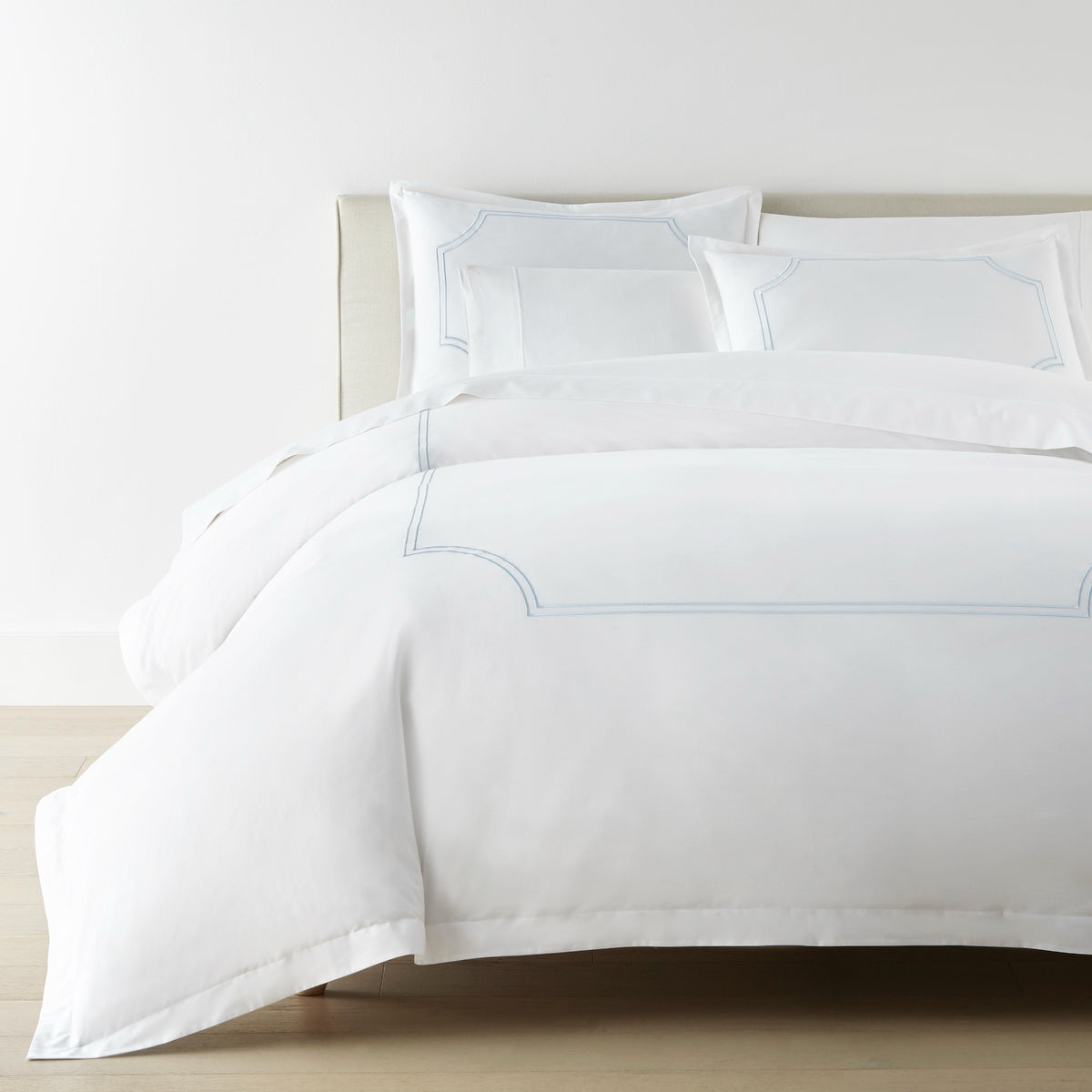 Corner View of Bed in Sky color Peacock Alley Deco Classic Embroidered Duvet Set