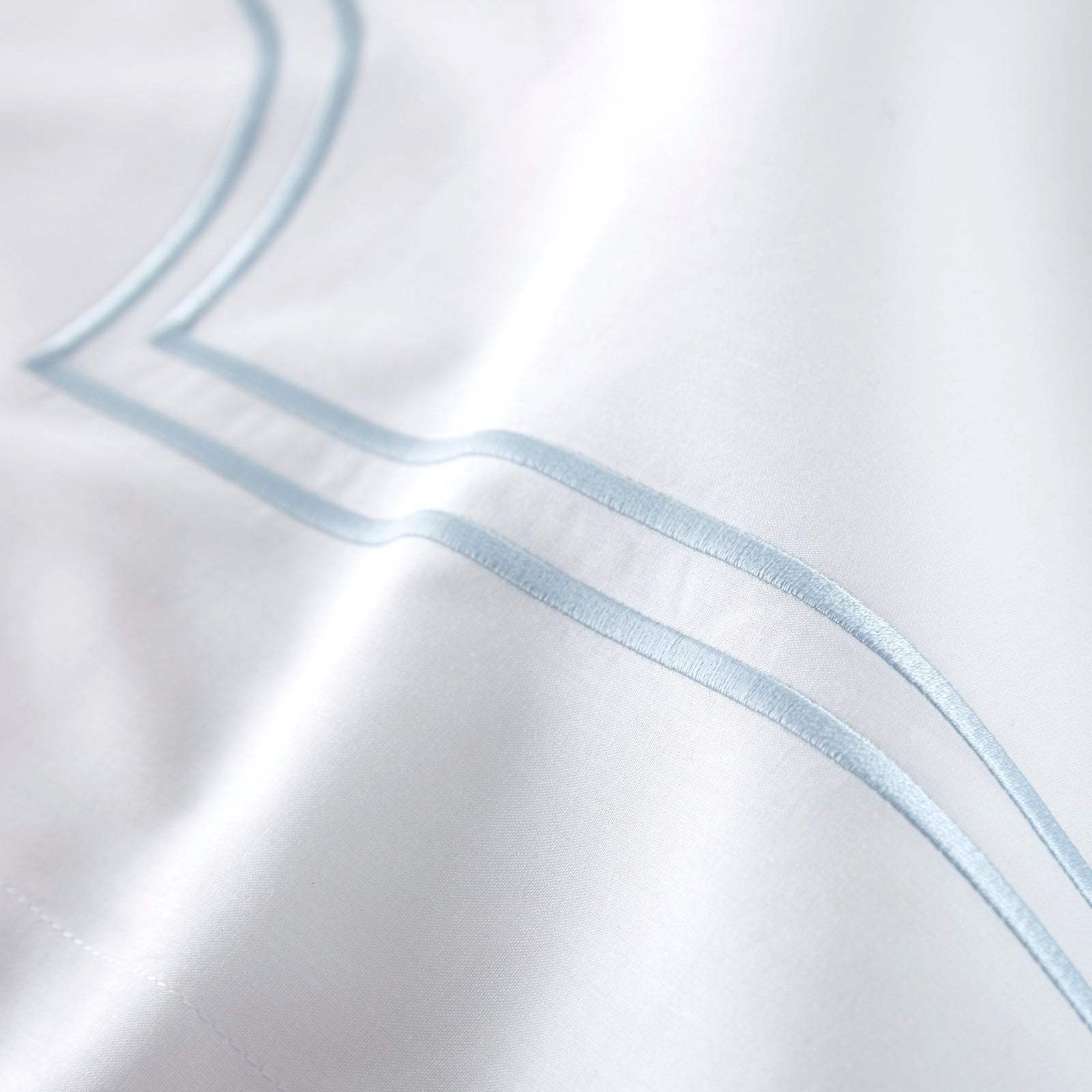 Bed in Sky color Peacock Alley Deco Classic Embroidered Duvet Set