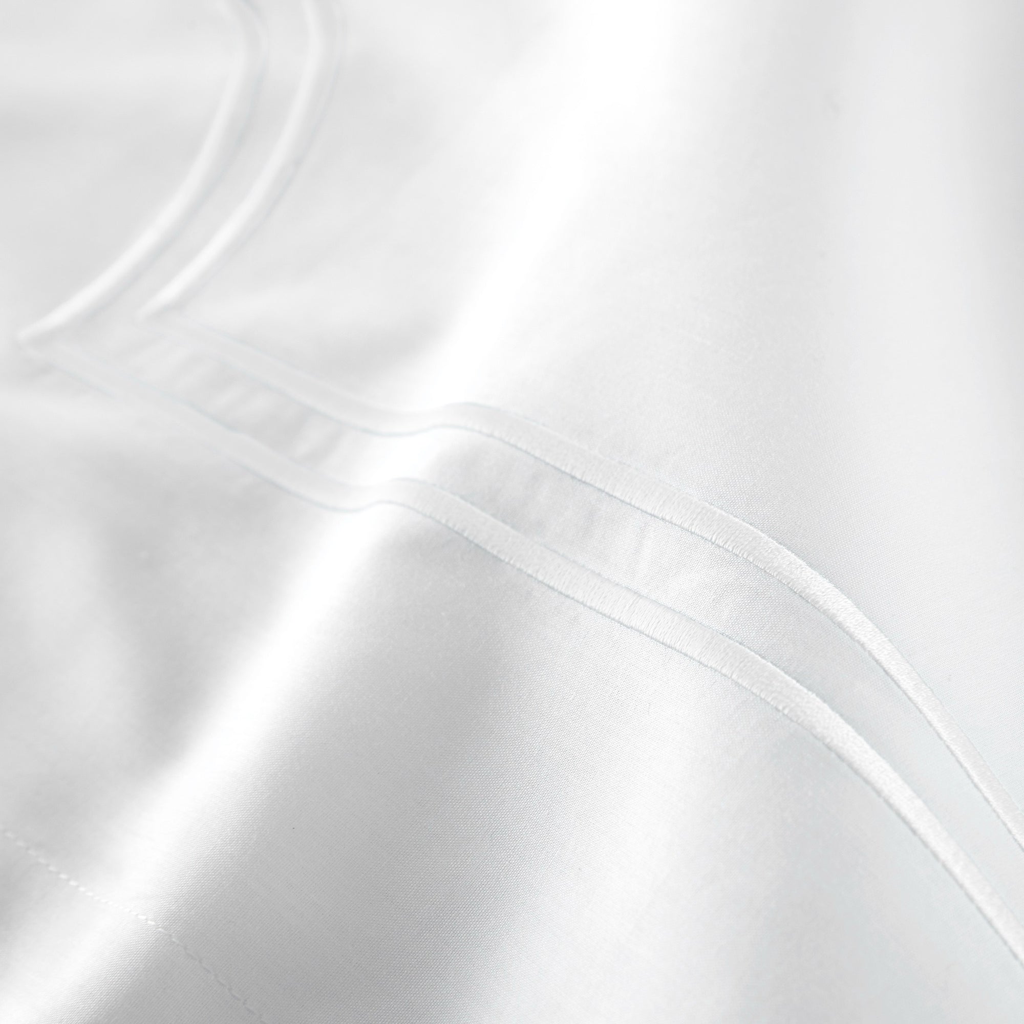 Corner View of Bed in White color Peacock Alley Deco Classic Embroidered Duvet Set