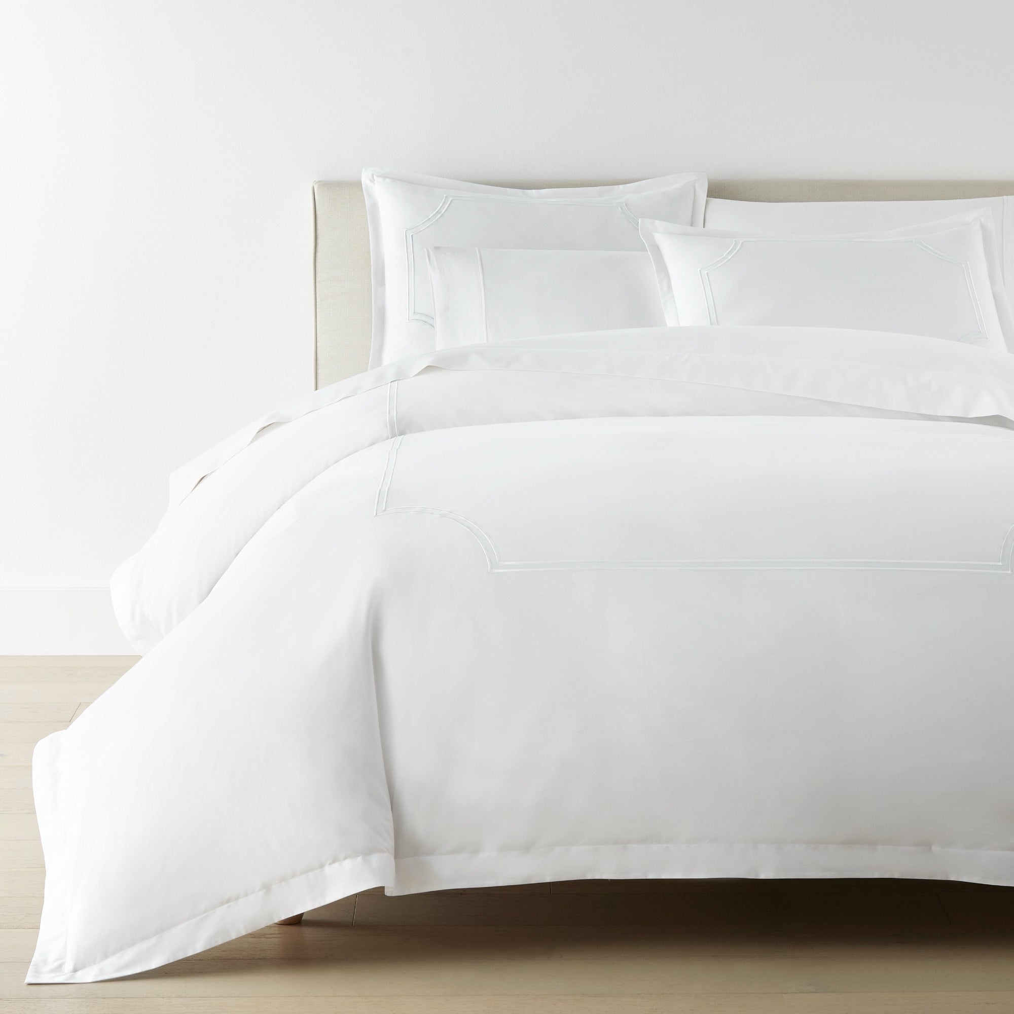 Corner View of Bed in White color Peacock Alley Deco Classic Embroidered Duvet Set