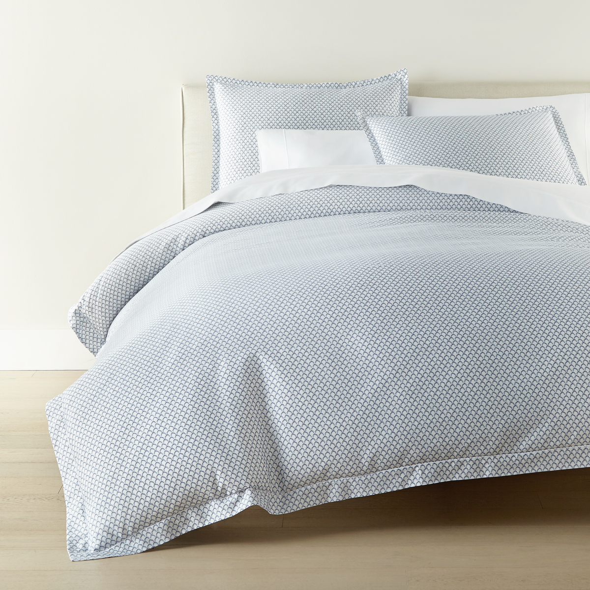 Corner View of Peacock Alley Demi Duvet Cover and Shams in Navy