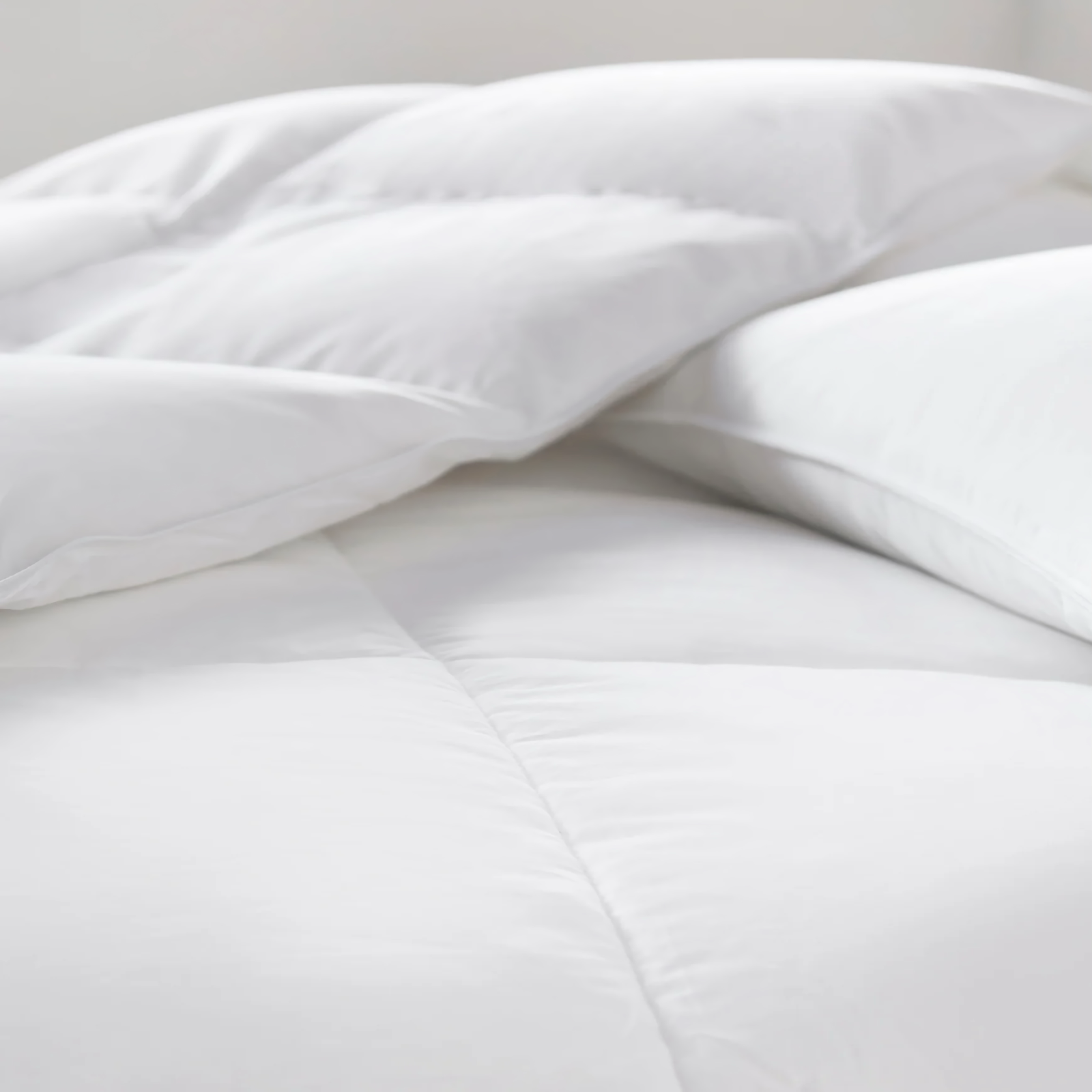 Lady Lying Comfortably on Peacock Alley Down Alternative Mattress Topper