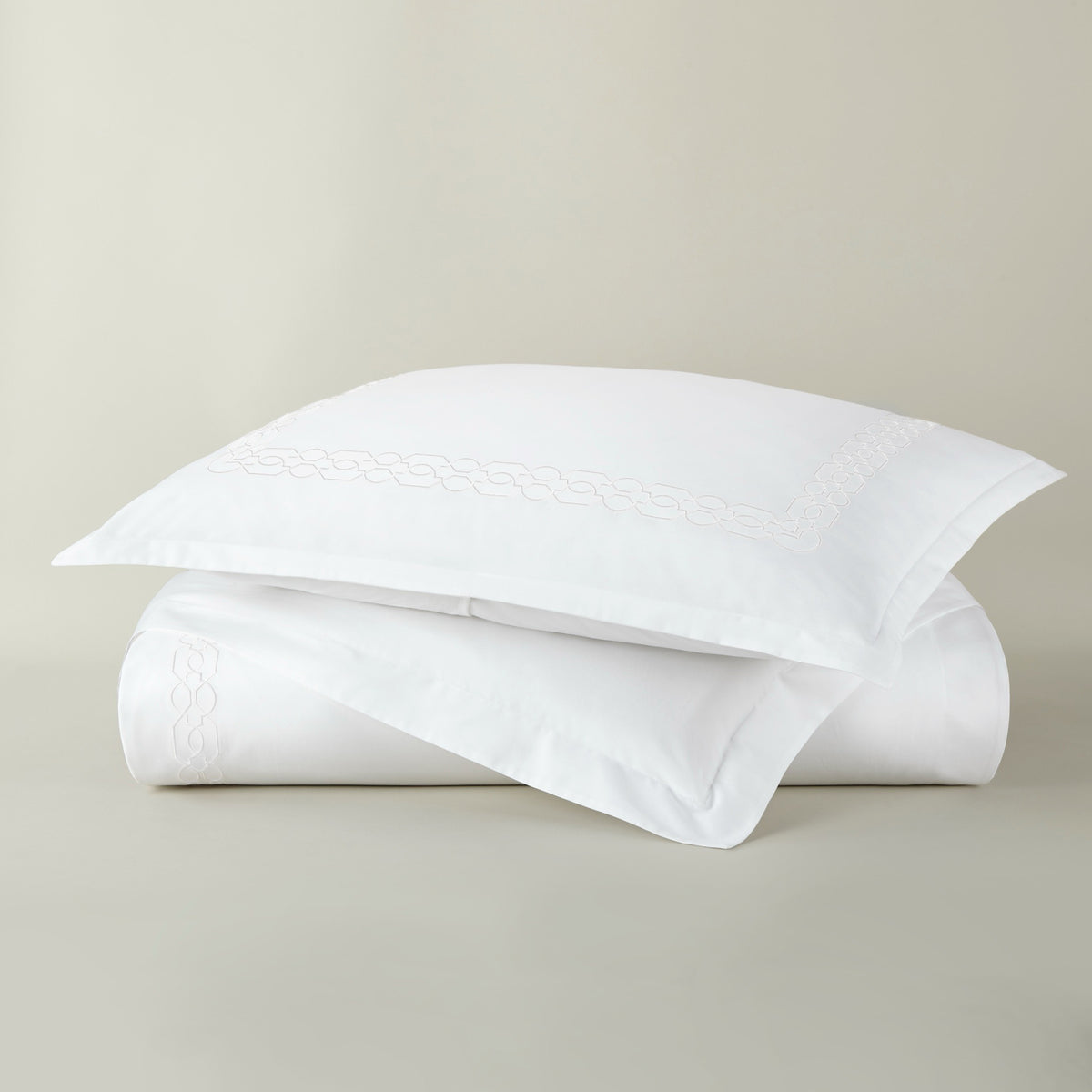 Stack of Peacock Alley Filigree Classic Embroidered Duvet Set in White color