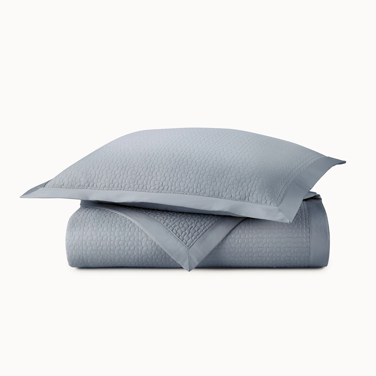 Stack of Peacock Alley Hamilton Coverlets and Shams in Blue
