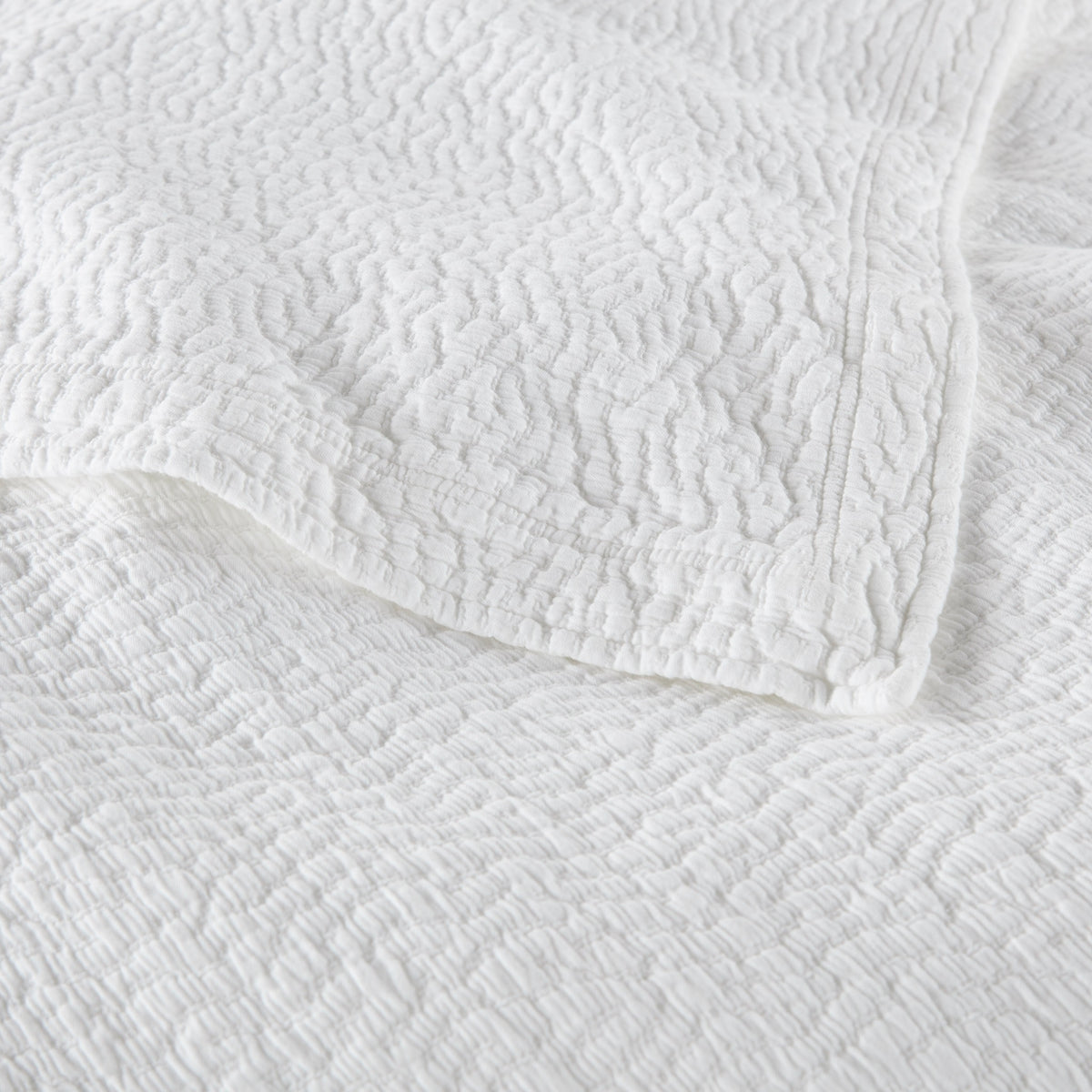 Detail Shot of Peacock Alley Mia Stonewashed Matelassé Bedding in Color White