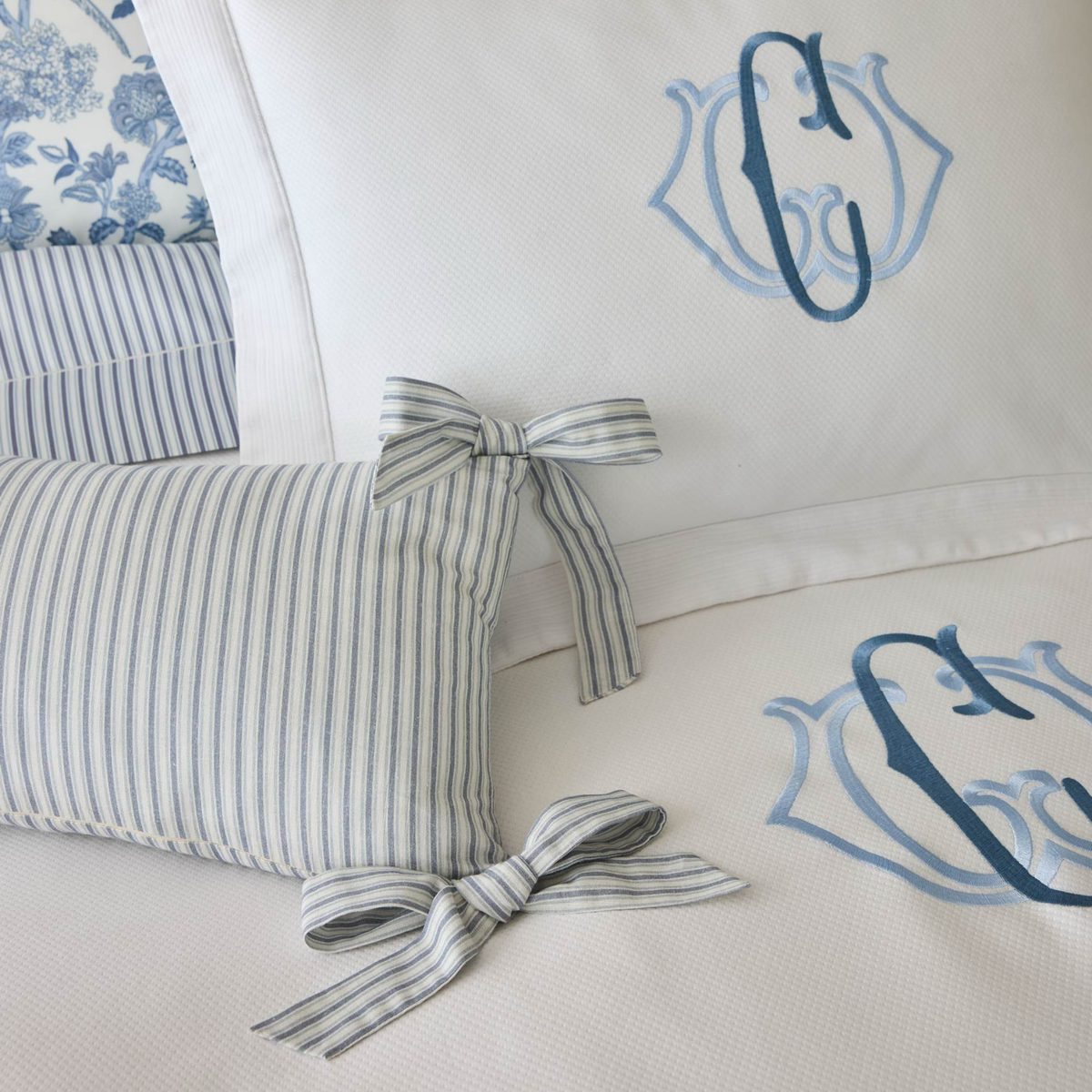 Wedgewood colored Peacock Alley Oblong Bow Pillow in coordinate with blue bedding