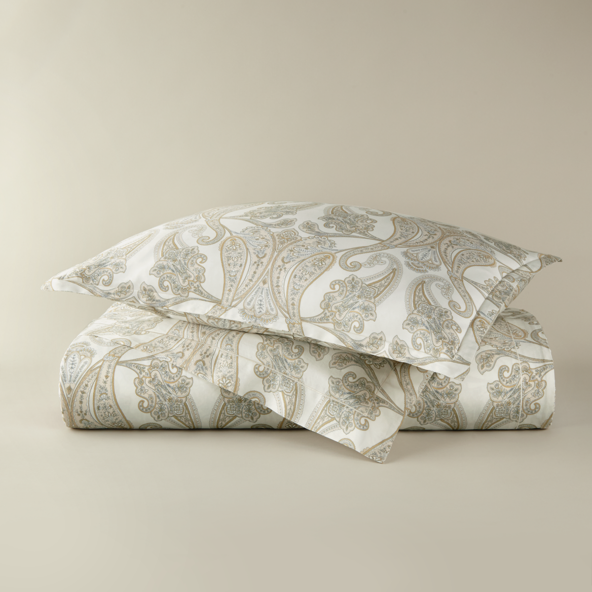 Stack of Peacock Alley Paisley Duvet Cover and Shams in Pearl