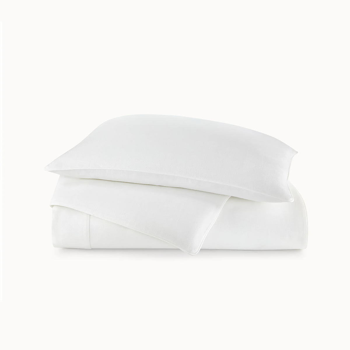Stack of Peacock Alley Rio Corded Duvet Cover and Sham in White