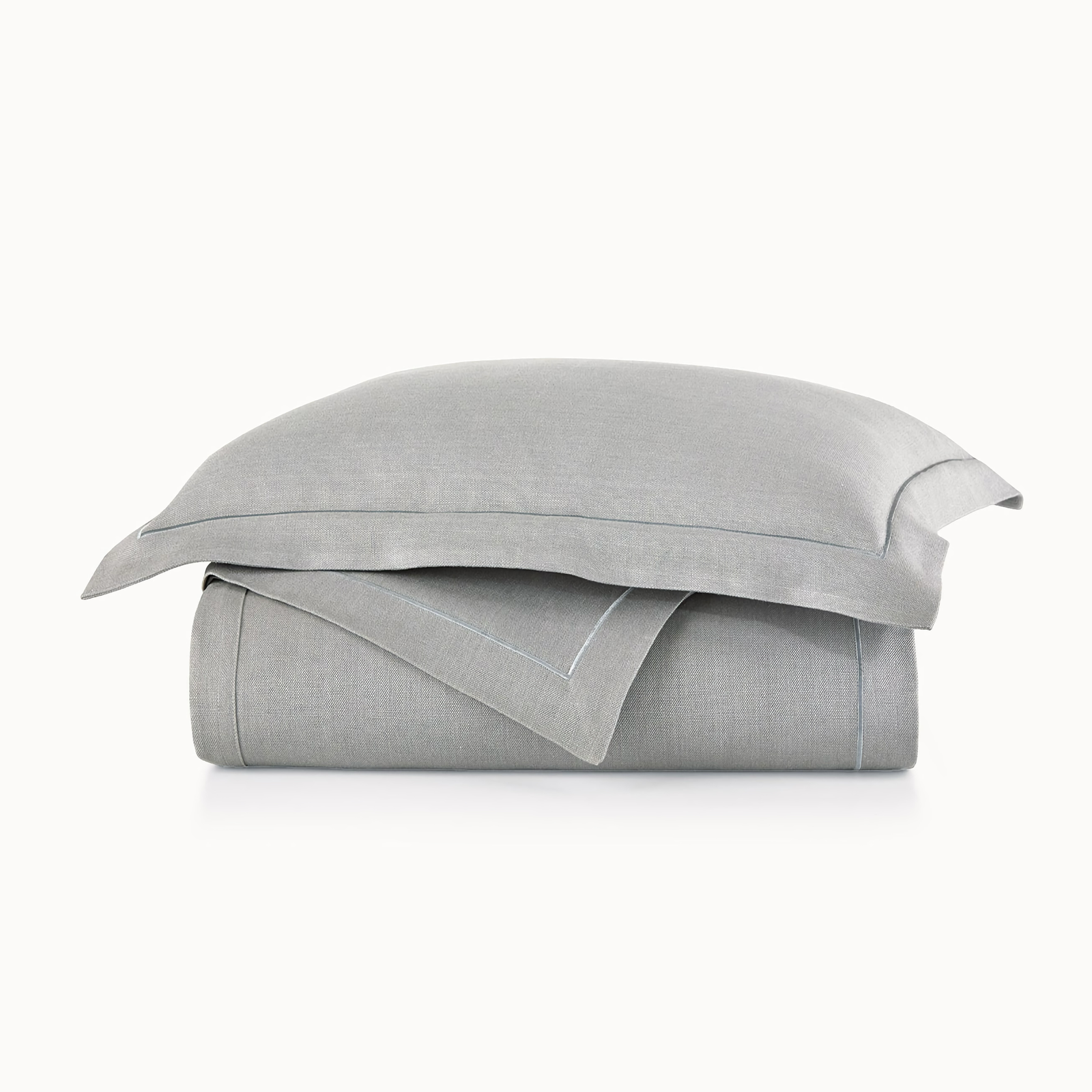 Stack of Peacock Alley Rio Satin Stitch Bedding in Pewter