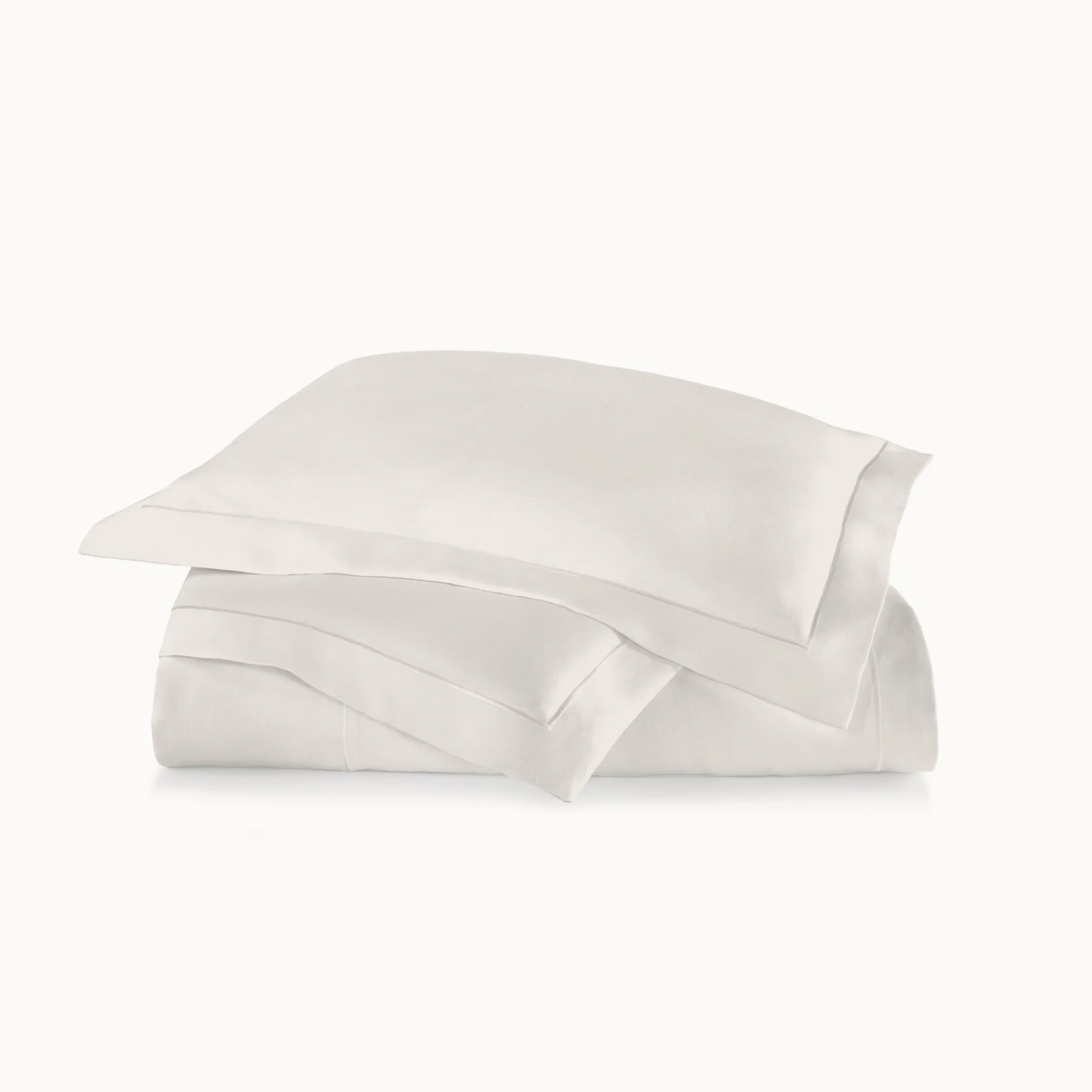 Stack of Peacock Alley Rio Satin Stitch Bedding in Platinum