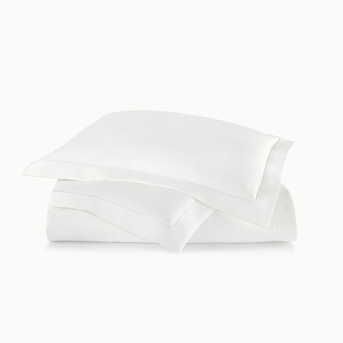Stack of Peacock Alley Rio Satin Stitch Bedding in White