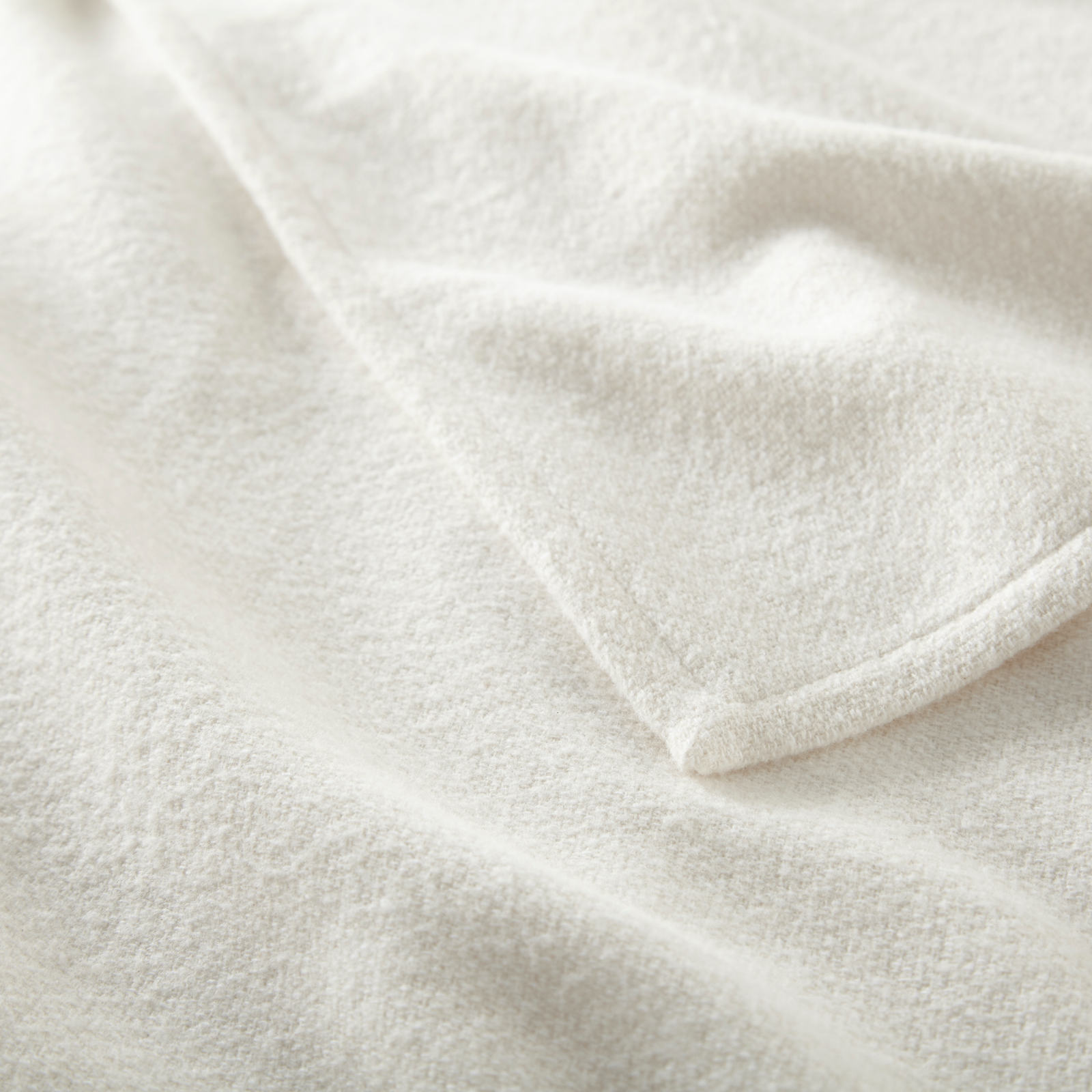 Folded of Peacock Alley Vineyard Throw in Pearl