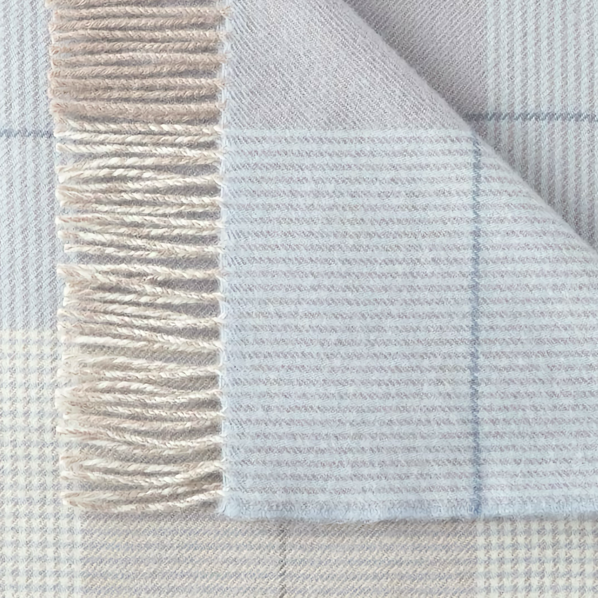 Closeup of Peacock Alley York Throw in Blue