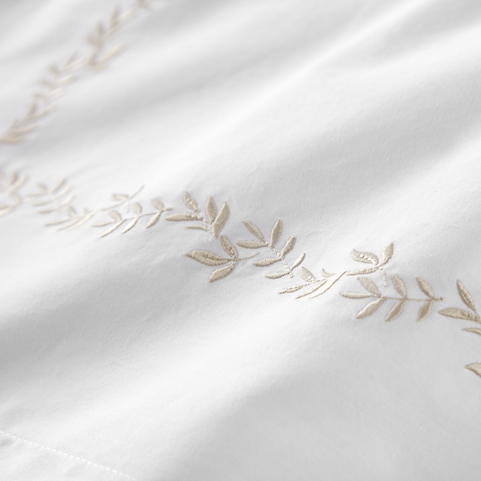 Peacock Alley Ivy Duvet Cover and Shams in Linen - side view of bed