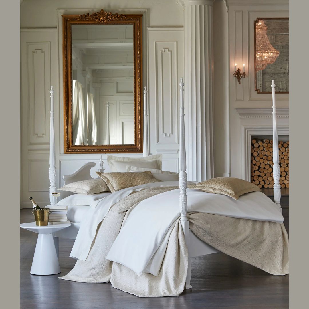 Peacock Alley bedding on a four poster bed in a grand room