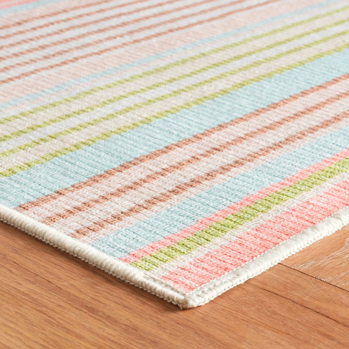 Corner of Aqua Pine Cone Hill Ana Ticking Machine Washable Rug