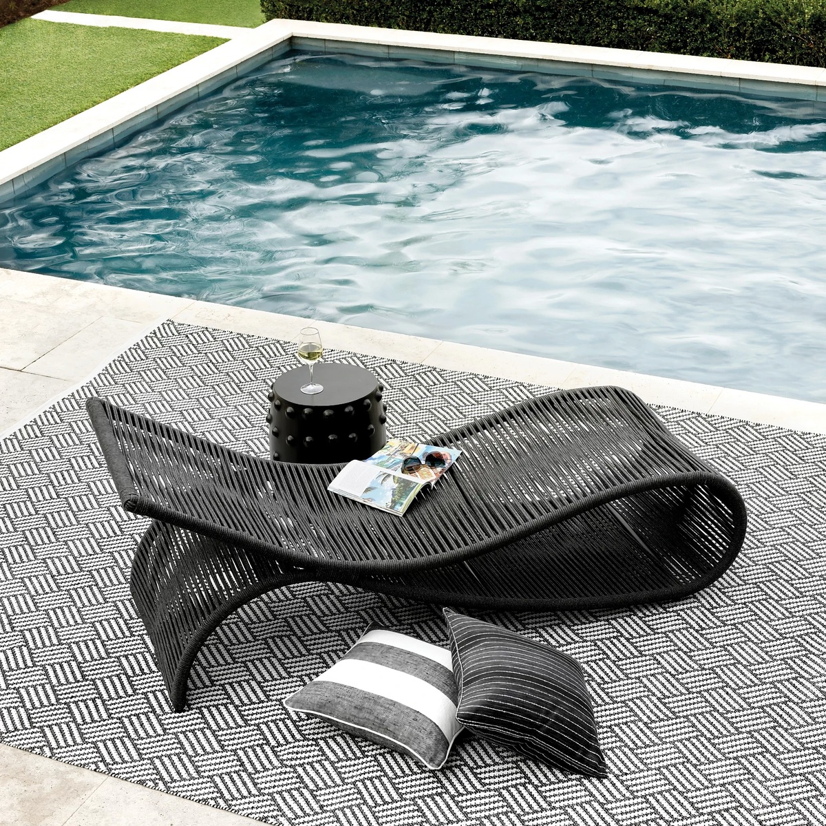 Poolside Image of Pine Cone Hill Awning Stripe Indoor/Outdoor Decorative Pillow in Black Color