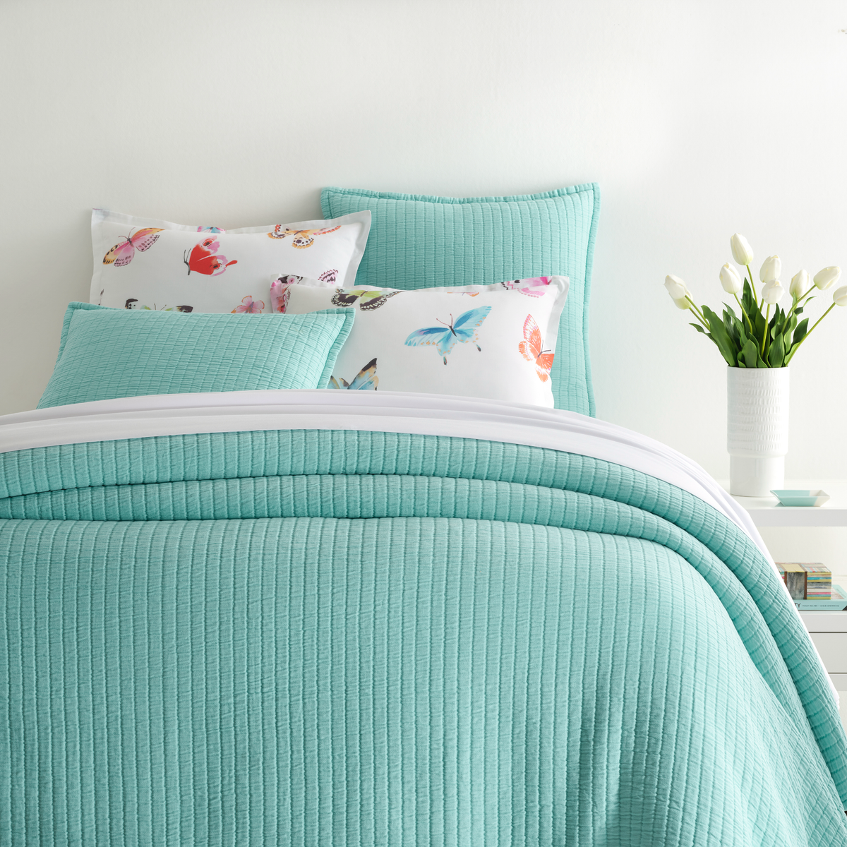 Closeup of Bed in Soft Turquoise Pine Cone Hill Boyfriend Matelassé Coverlet &amp; Shams