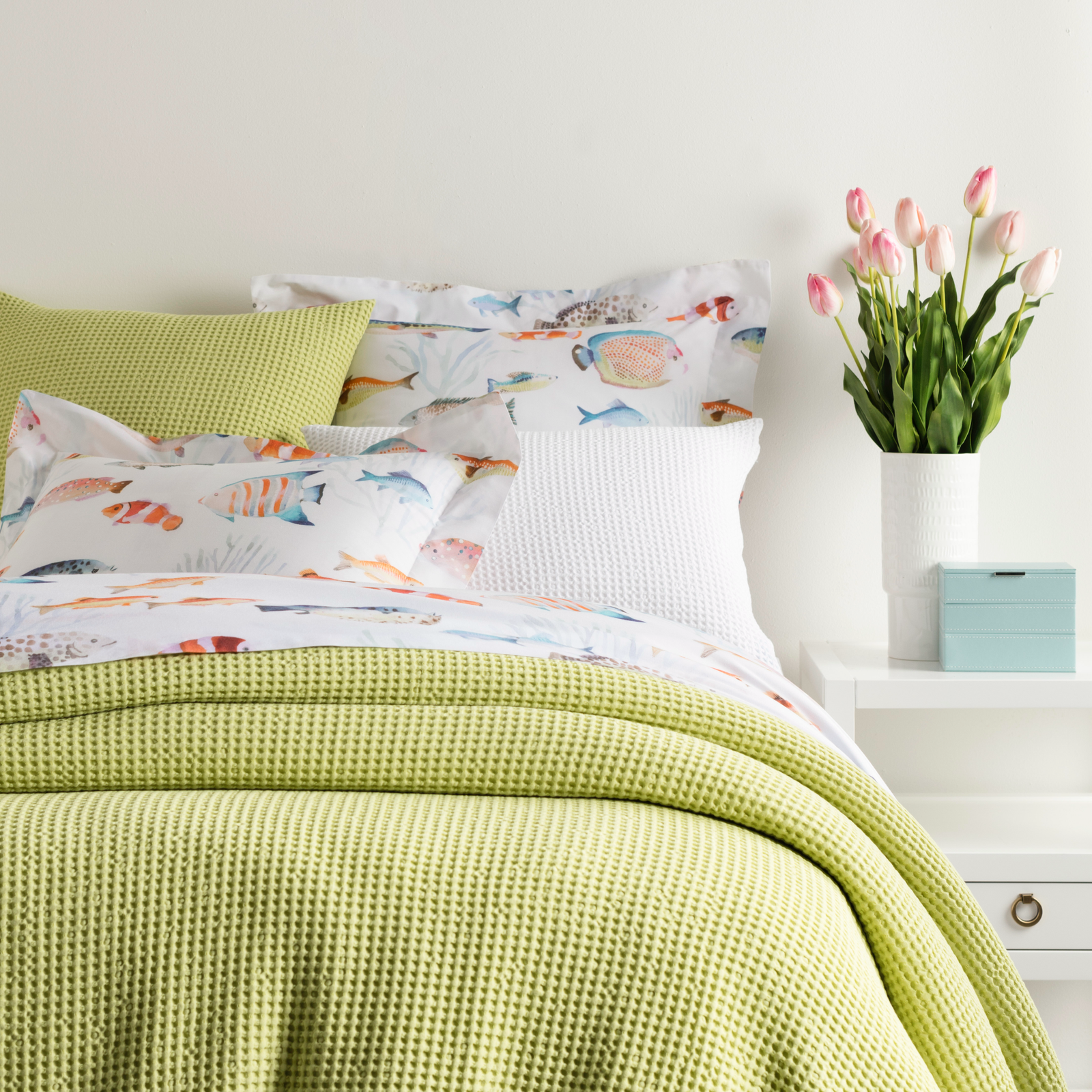 Closeup of Bed in Citrus Pine Cone Hill Bubble Matelassé Coverlet & Shams