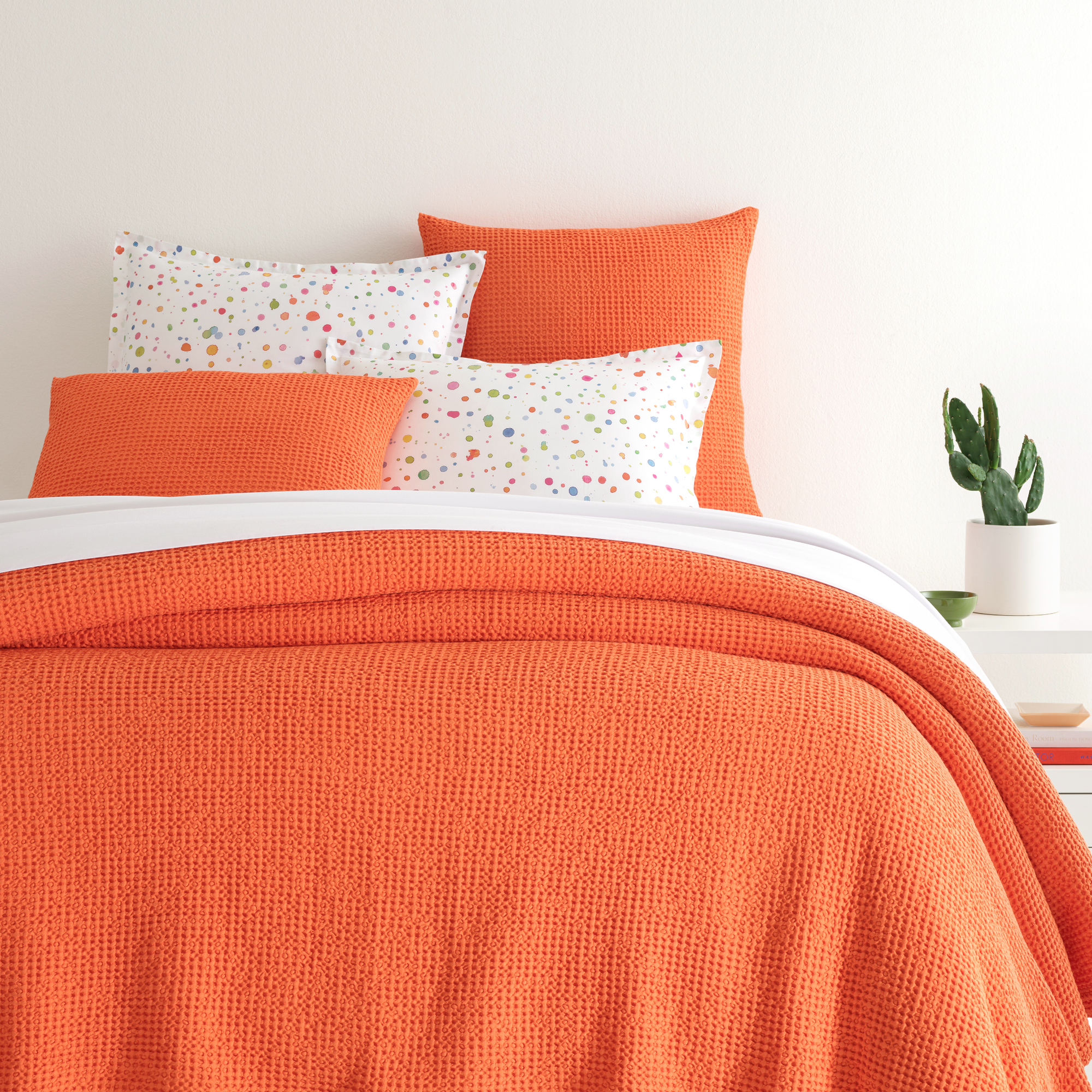 Closeup of Bed in Tangerine Pine Cone Hill Bubble Matelassé Coverlet & Shams