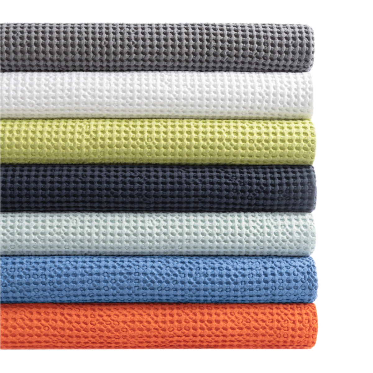 Stack of Different Colored Coverlets from Pine Cone Hill Bubble Matelassé Fine Linen