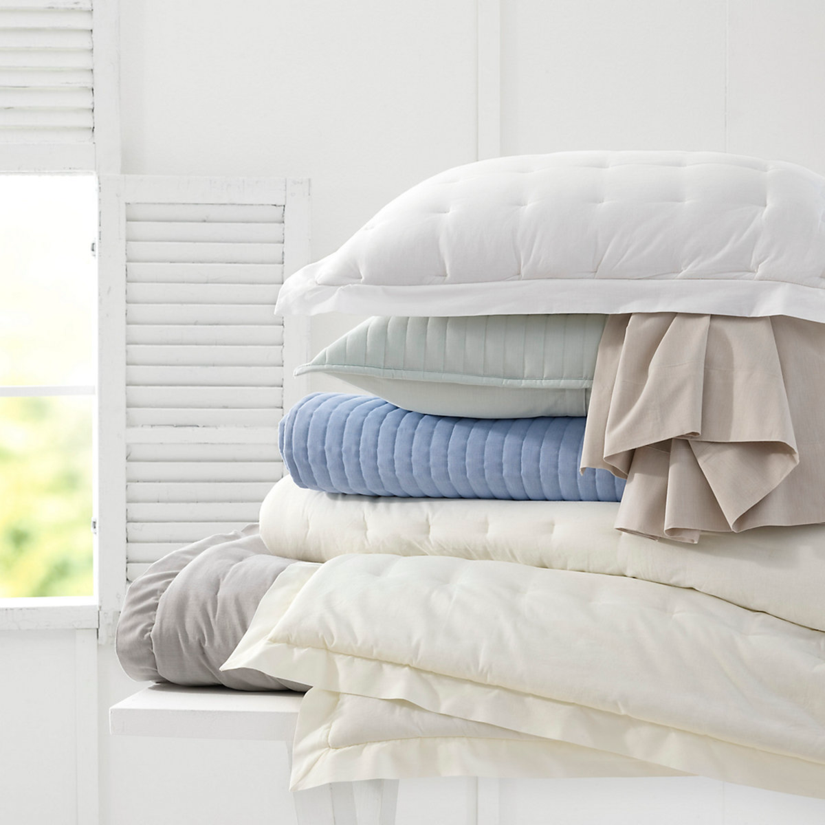 Stack of Pine Cone Hill Cozy Cotton Shams and Sheets
