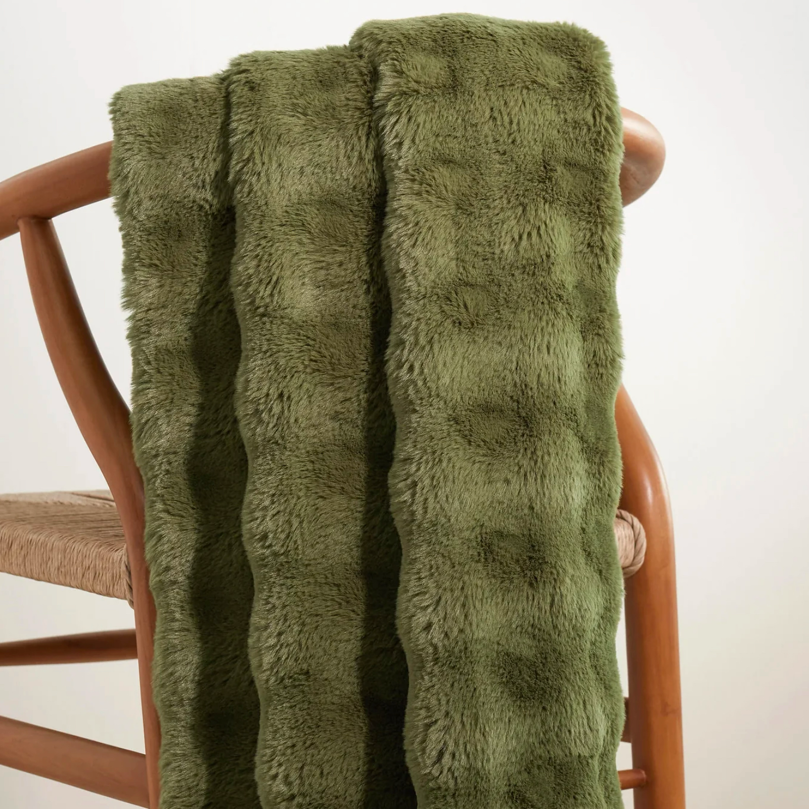 Olive Pine Cone Hill Fab Faux Throw on a chair