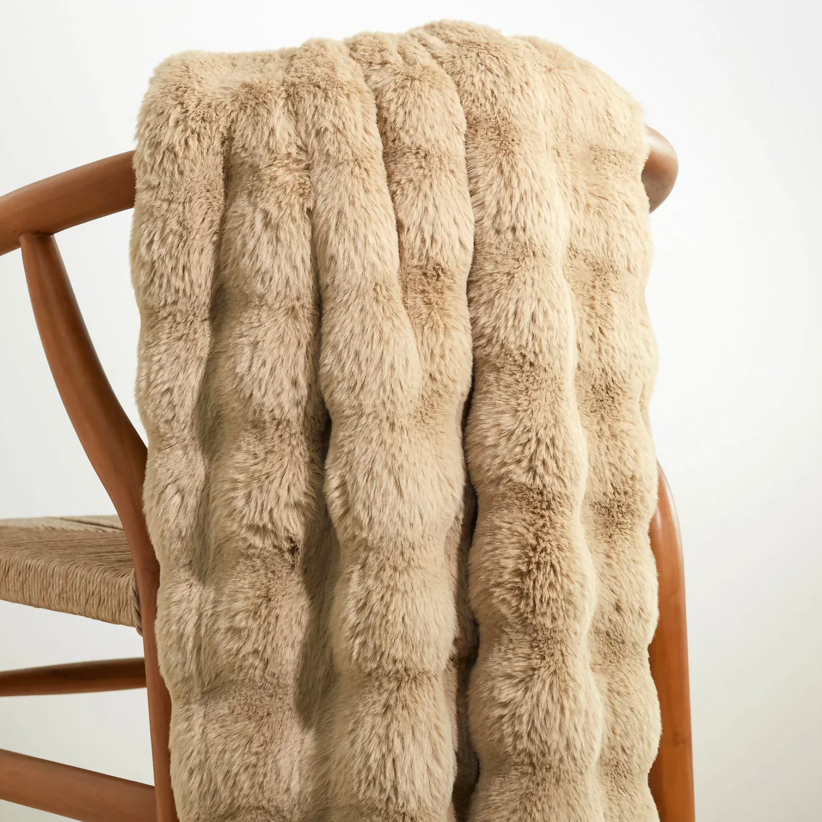 Sand Pine Cone Hill Fab Faux Throw on a chair